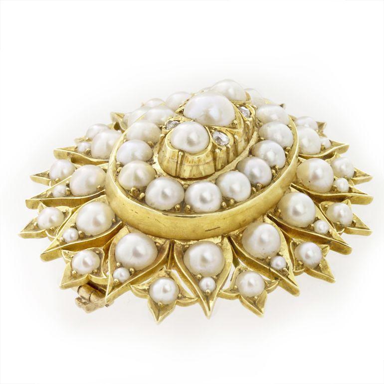 A Victorian natural half pearl and diamond oval brooch-pendant, set to the centre with three graduating half pearls set with rose-cut diamonds, surrounded by cluster of fourteen half-pearls, within half-pearl set border, all claw-set to a yellow