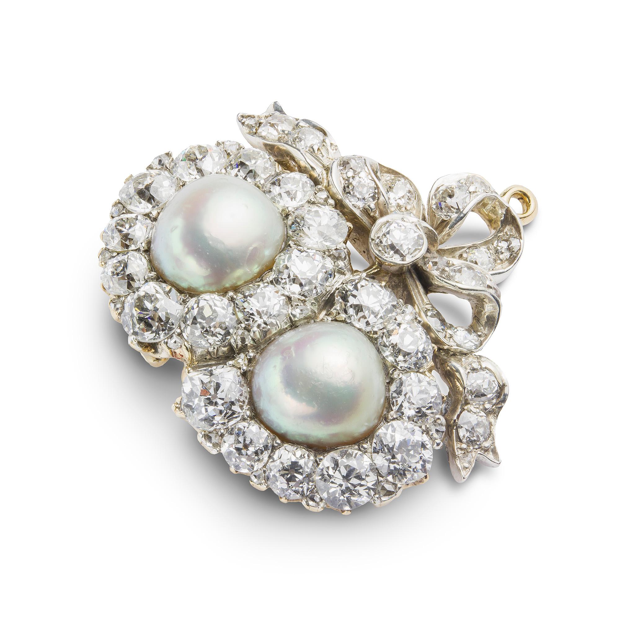 A Victorian pearl and diamond double heart brooch, each heart set with a natural saltwater oval button-shaped pearl to the centre of an old brilliant-cut diamond surround, with diamond-set ribbon bow surmount, the diamonds estimated a total of 3.8