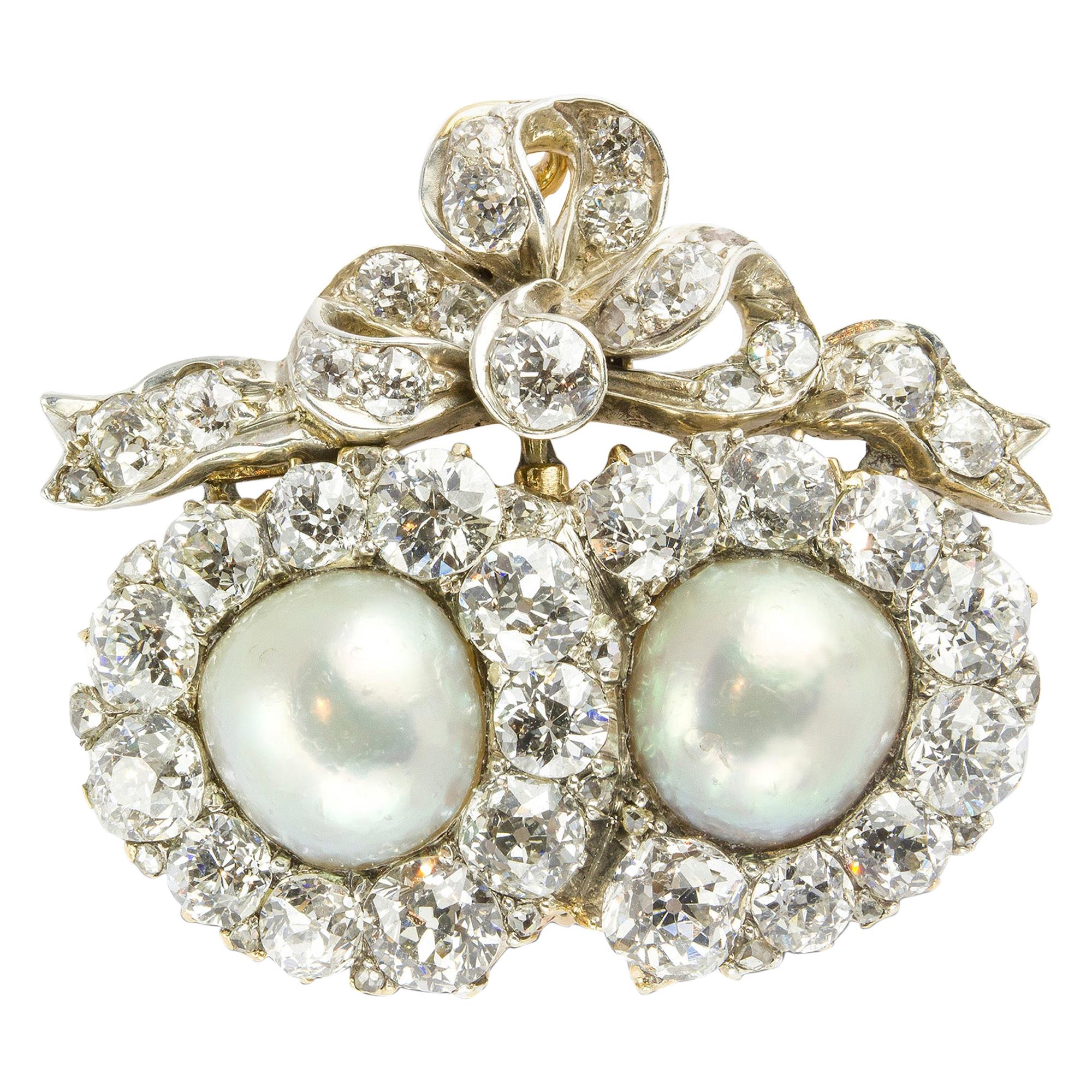 A Victorian Pearl and Diamond Double Heart Brooch For Sale