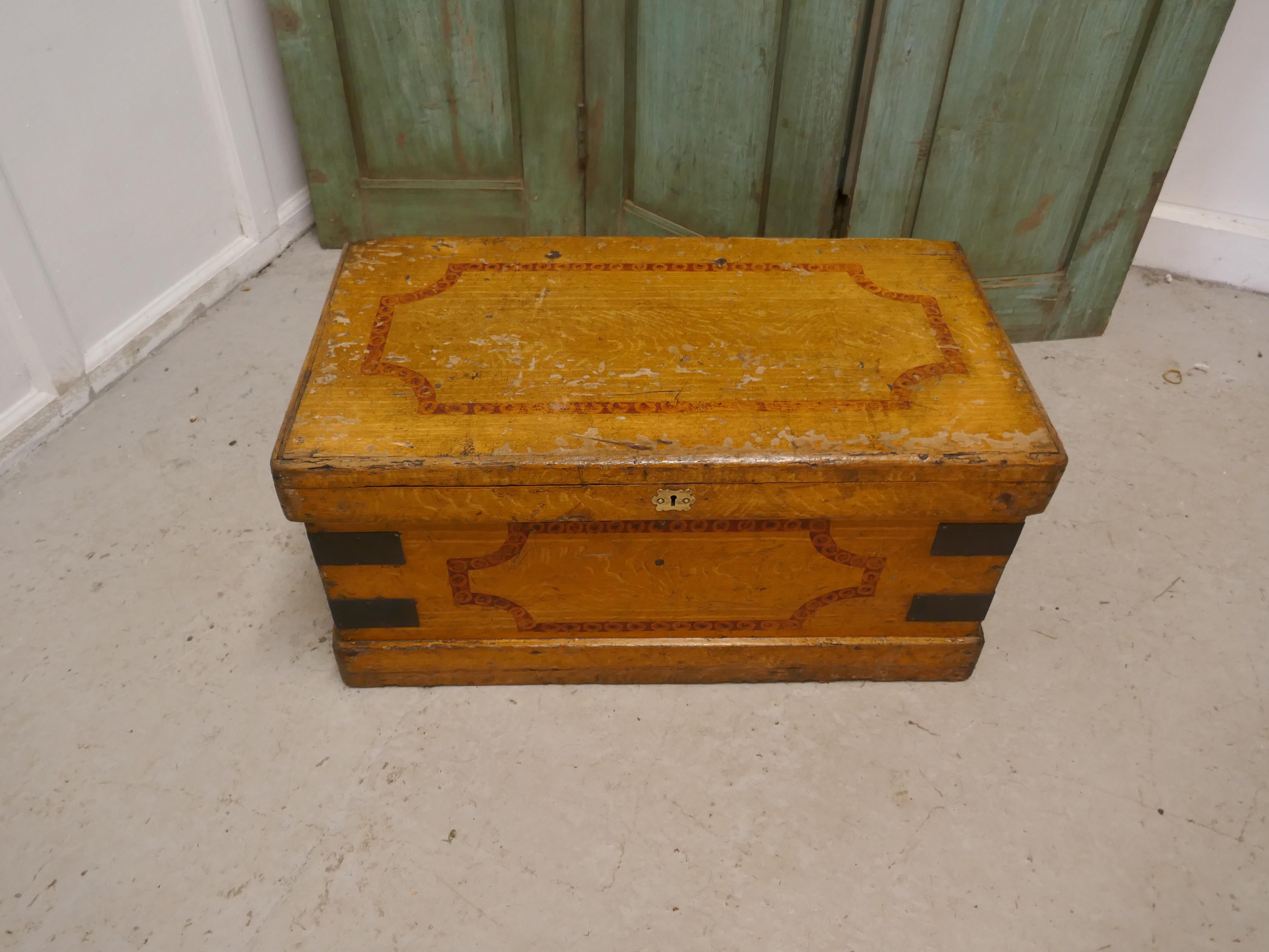 A Victorian pine blanket chest

This is a best quality box, it has an original scumble finish and the interior is lined with the original decorative paper 
The box has iron banding on the outside, it stands on a small plinth and has carrying
