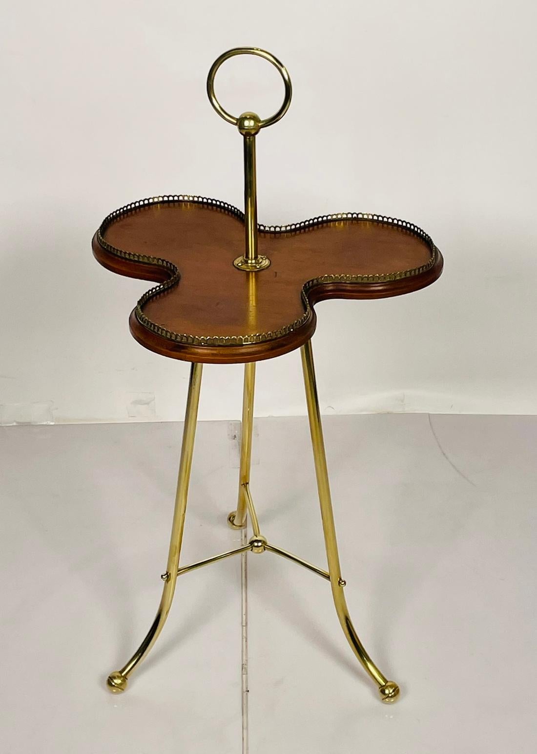 English A Victorian Revolving Occasional Table in Brass & Mahogany.