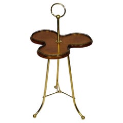 A Victorian Revolving Occasional Table in Brass & Mahogany.