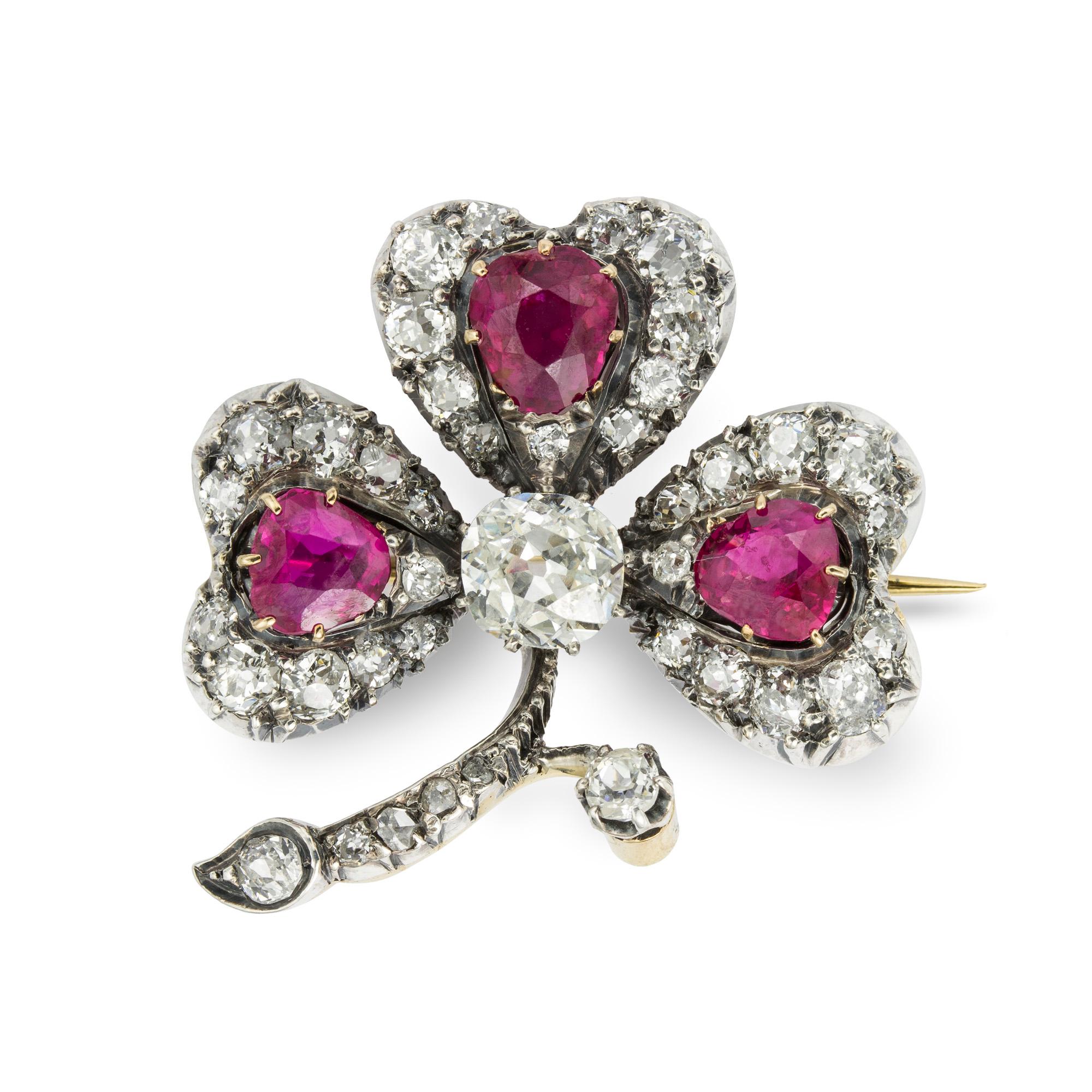 Art Nouveau An Early 20th Century Ruby And Diamond Clover Brooch For Sale