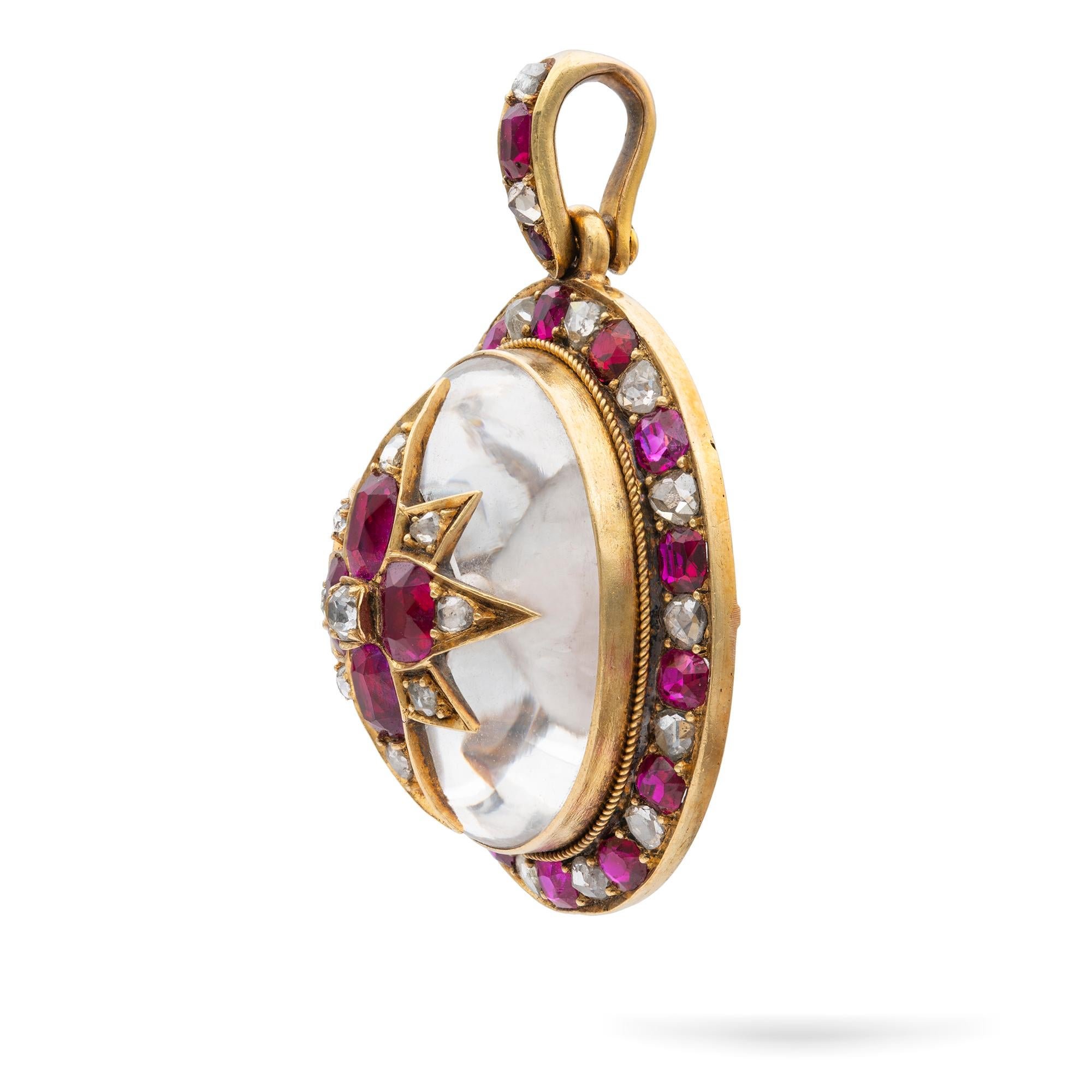 A ruby, diamond, and crystal pendant, the domed crystal with a star to the centre set with four oval-cut rubies surrounded by old round-cut diamonds, the crystal dome backed with blue fabric, to a border of rubies and old-cut diamonds alternating,