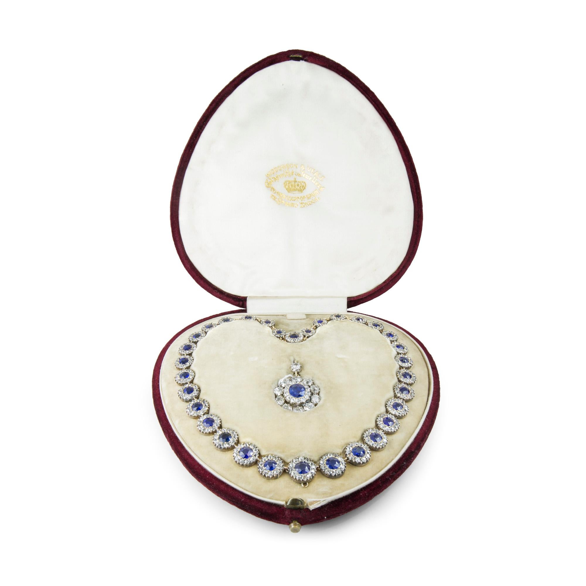 A Victorian sapphire and diamond cluster necklace, the necklace consisting of thirty-two graduating sapphire and diamond clusters, each set with round faceted sapphire surrounded by old-cut diamonds, estimated total sapphire weight 17 carats,
