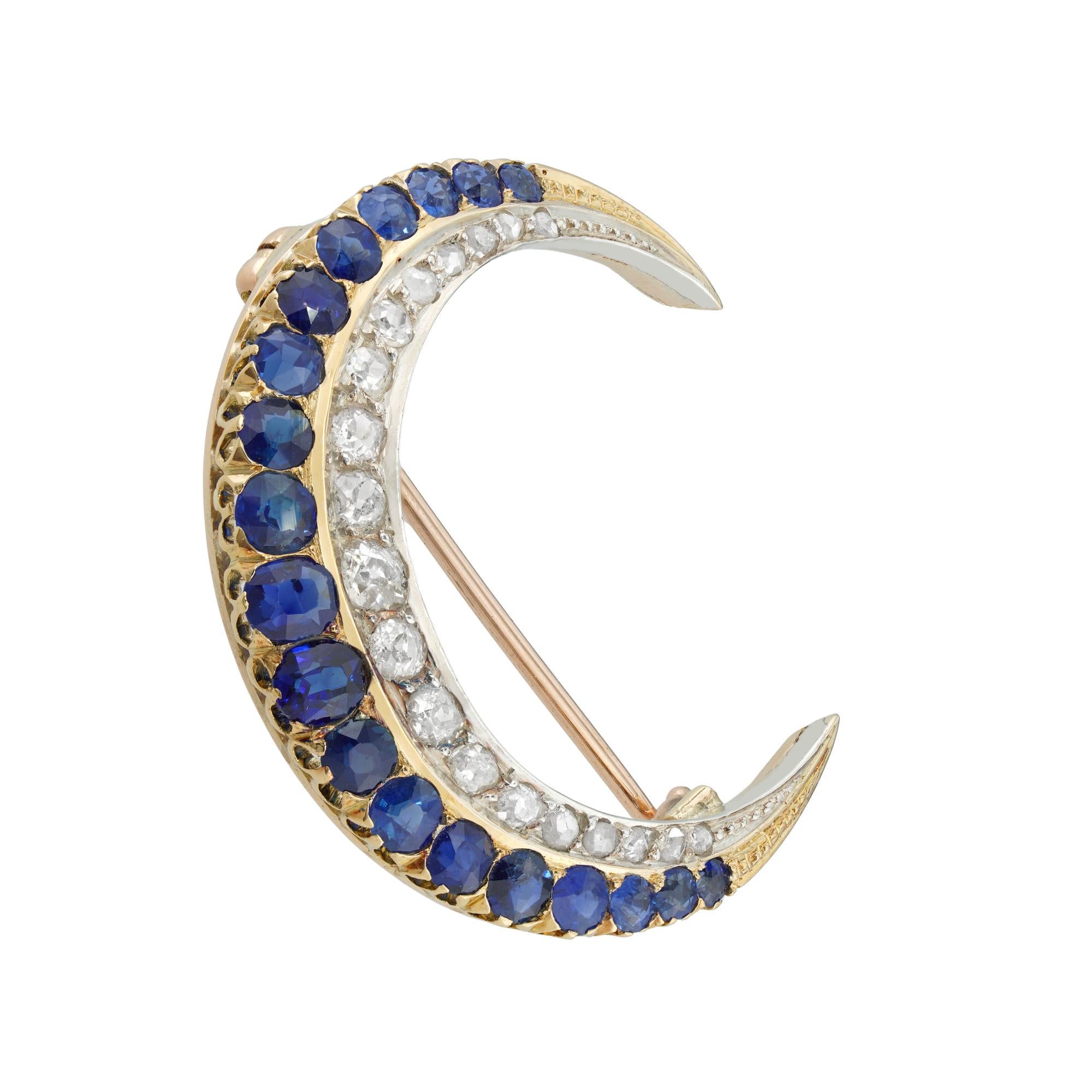 A Victorian sapphire and diamond crescent brooch, consisting of a row formed by nineteen faceted sapphires graduating in size from the centre and estimated to weigh approximately 2 carats in total, and a row of old European and rose-cut diamonds
