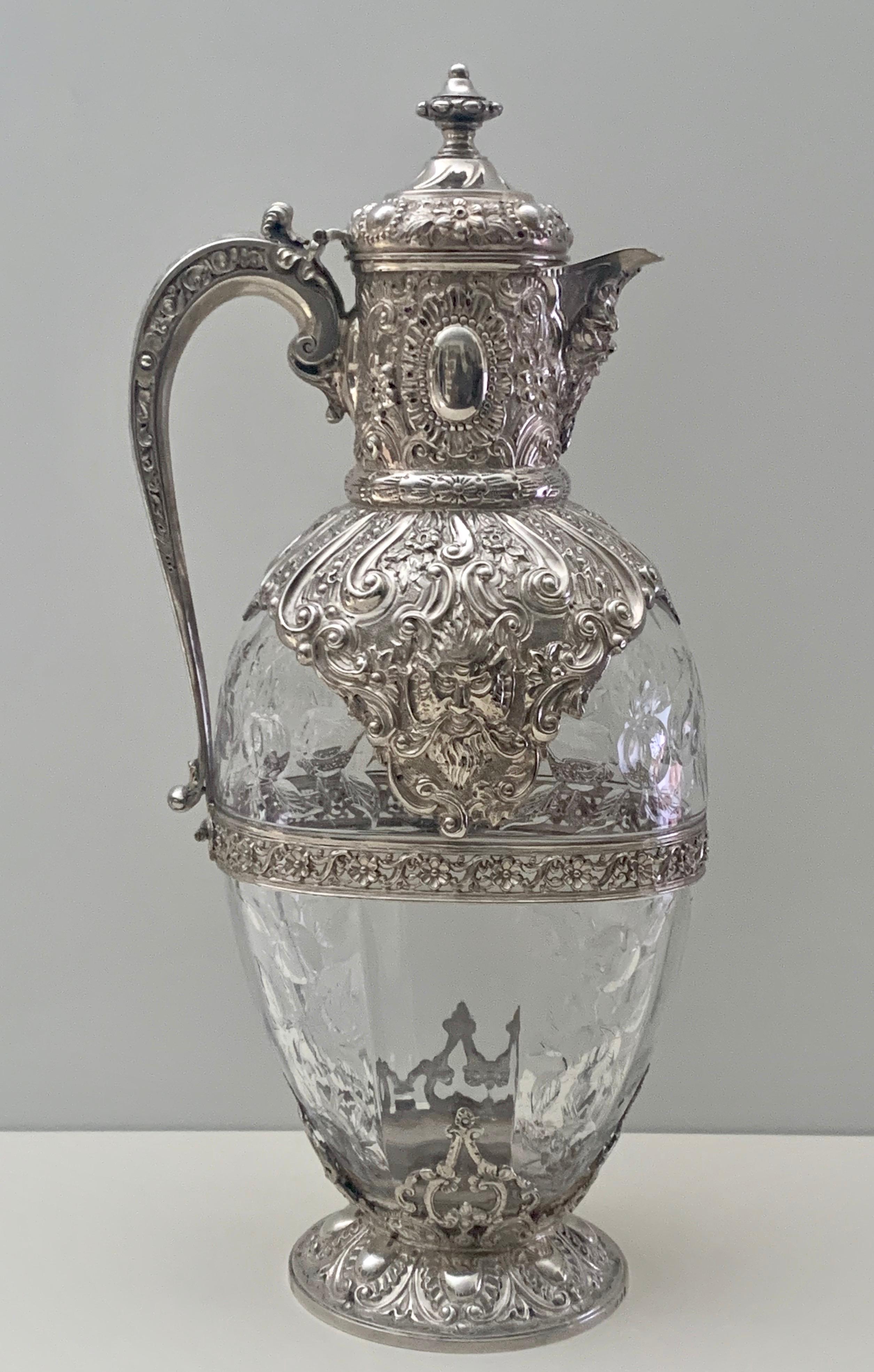 A stunning Victorian silver and 'Rock Crystal' glass claret jug
by Charles Edwards, fully hallmarked for London 1892, this superb quality carved glass claret jug with silver mounts to top and foot. the mounts embossed with scrolls, flowers,