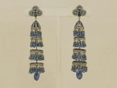 A Victorian style danglers with natural blue sapphire in silver and 18K gold
