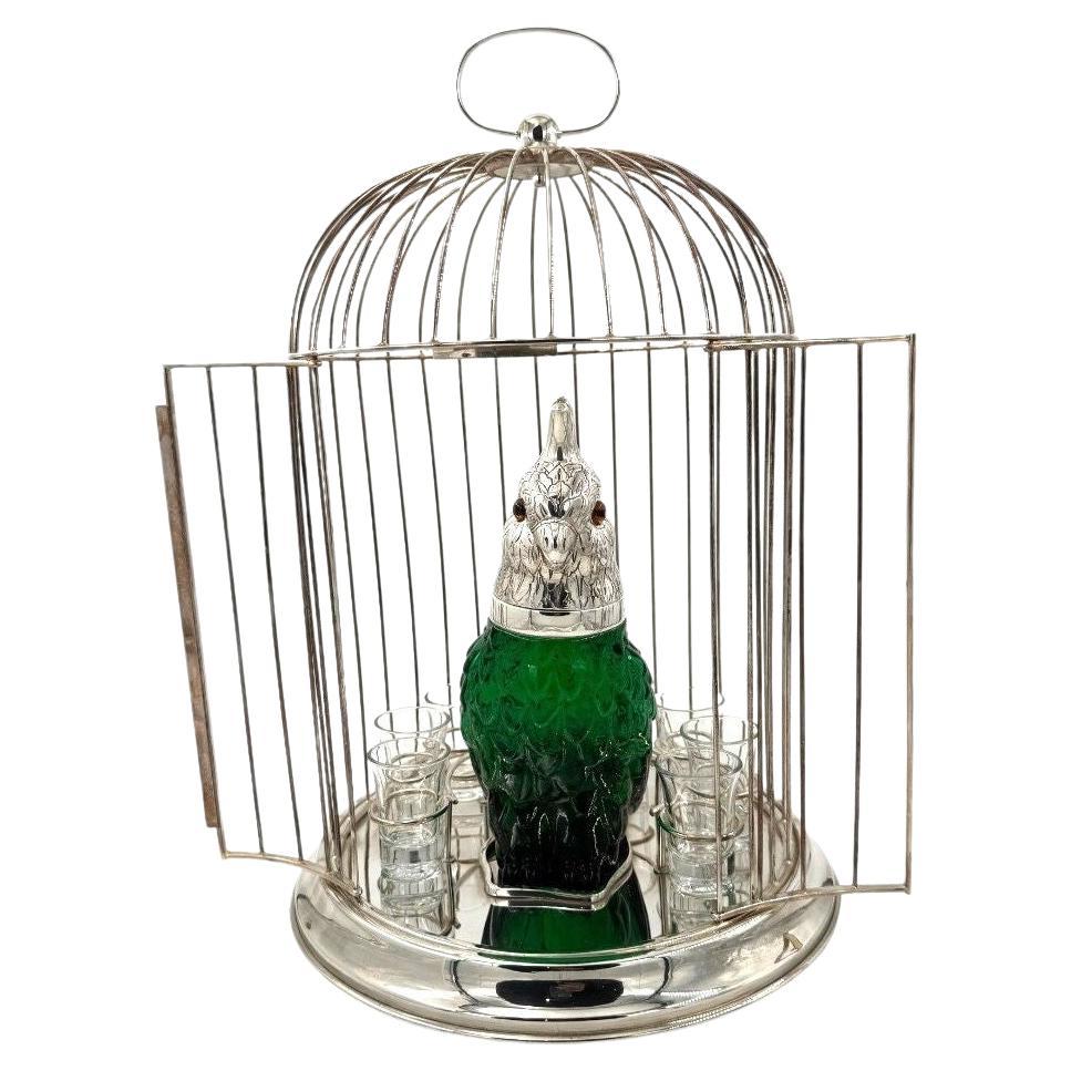 A Victorian style green glass, cockatoo decanter in silver plated cage For Sale