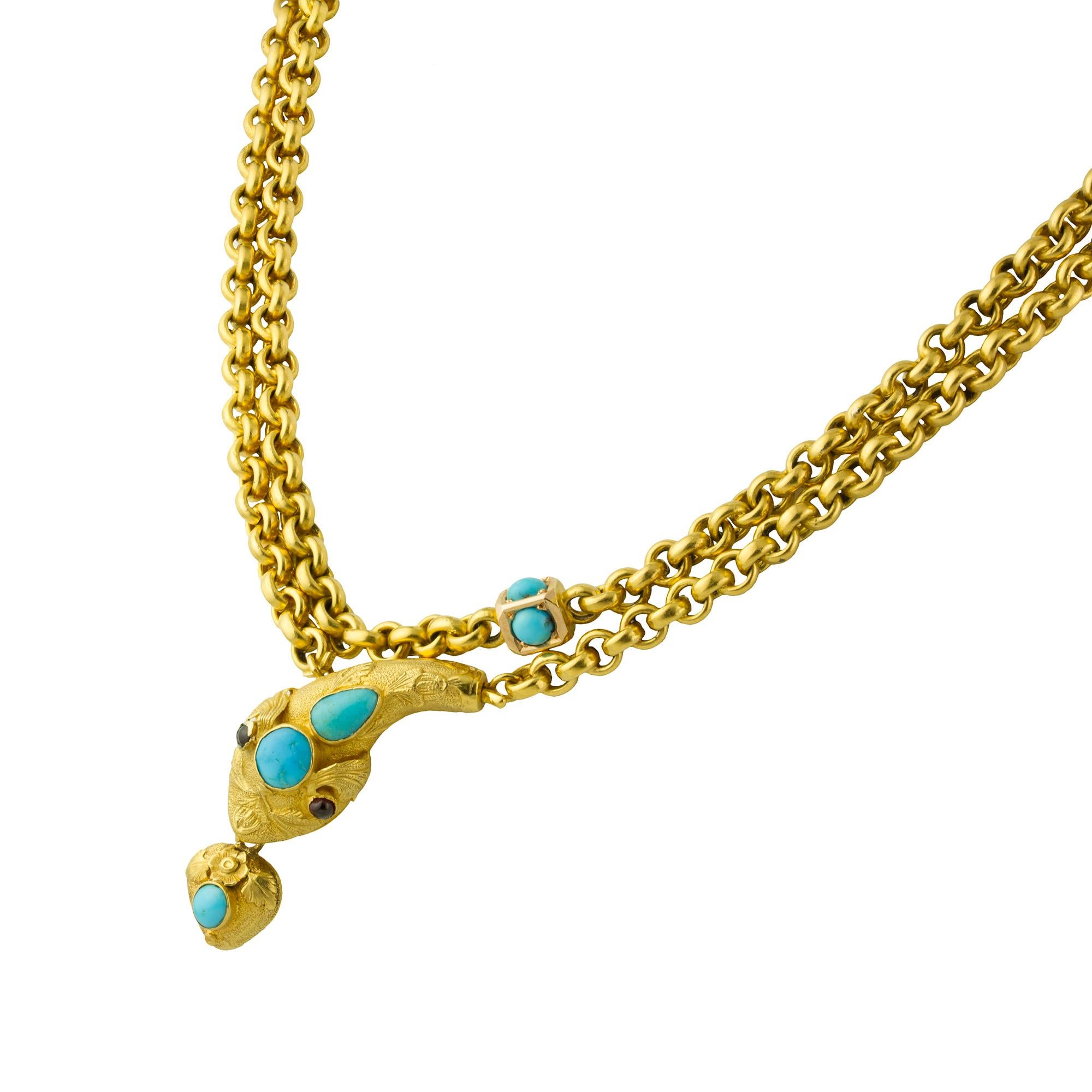 A Victorian turquoise and gold serpent chain necklace, a yellow gold muff chain set with nine turquoise beads within a yellow gold square, leading to an ornate serpent head set with turquoise and garnet eyes, the mouth suspending a heart shape