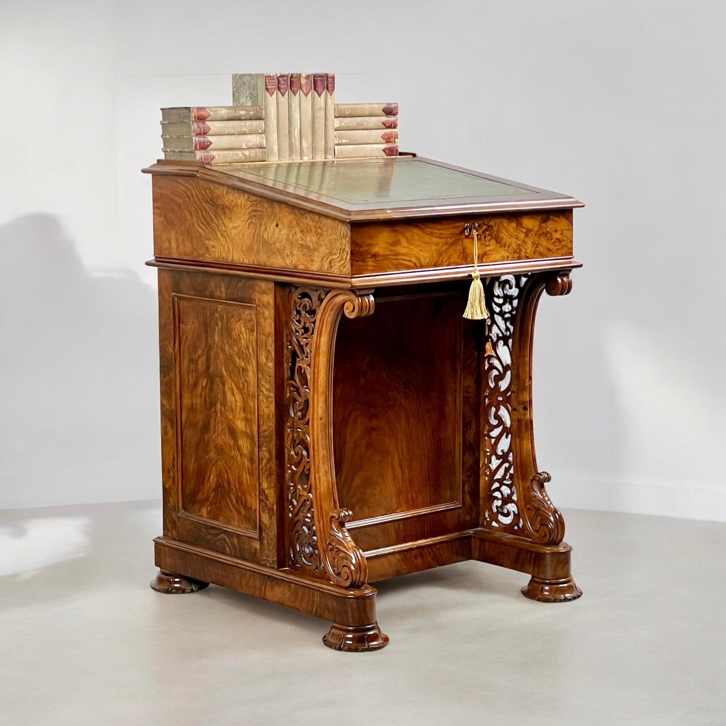 A Fine Victorian Walnut Davenport Desk by Wilkinson & Son, London
Beautifully crafted in walnut, mahogany, and satinwood. Stamped Wilkinson & Son.

The top features a tooled leather writing surface, enclosing a large storage compartment with two