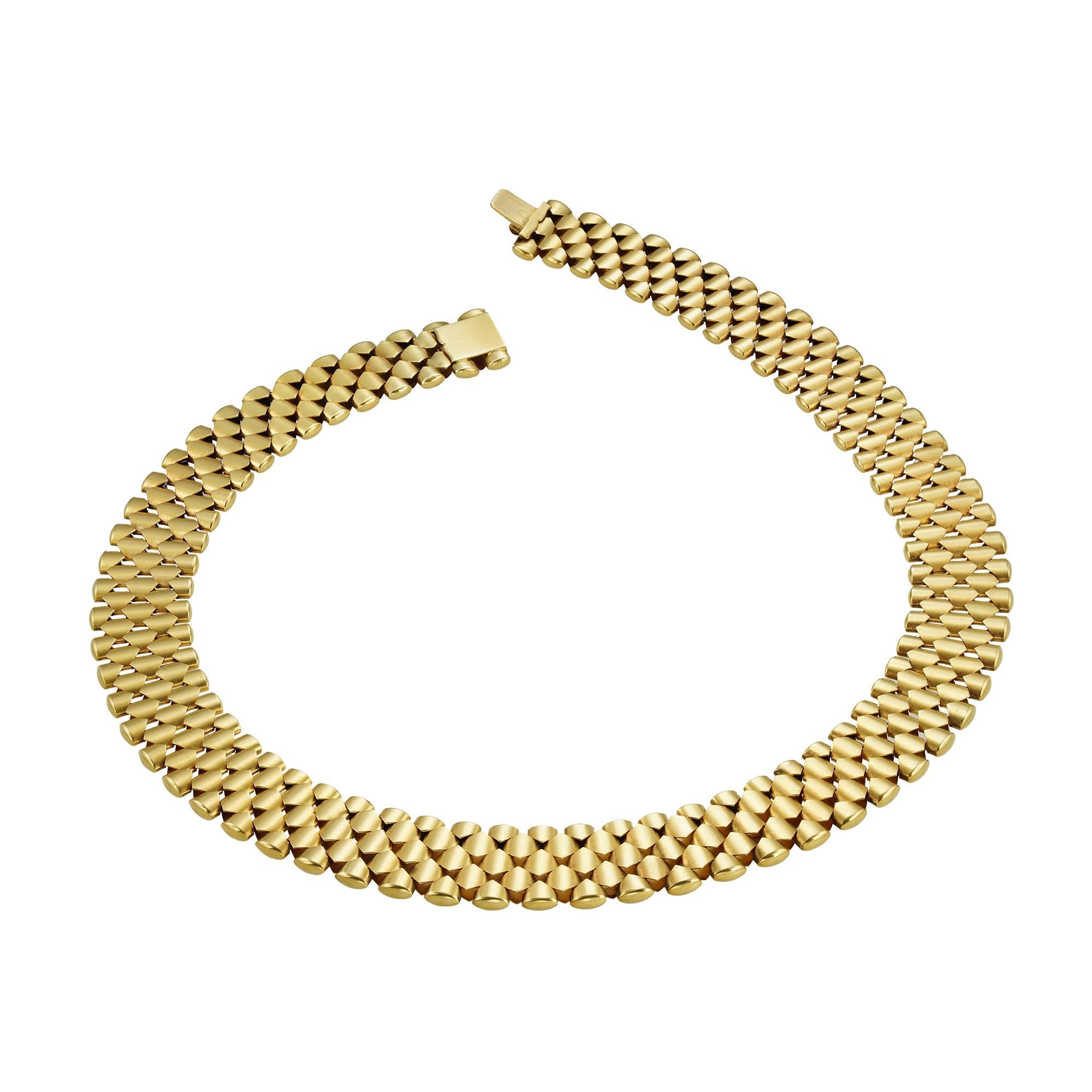 A Victorian yellow gold collar necklace, with interlocking links in diamond pattern, made in yellow gold with hidden clasp, circa 1870, unmarked, tested as 15ct gold, measuring approximately 43 x 1.7cm, gross weight 66 grams.

This antique necklace