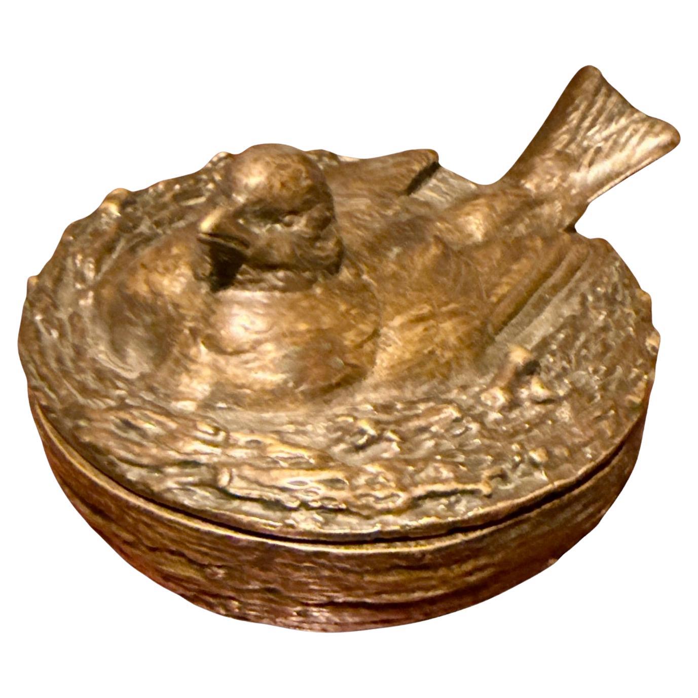 A vide-poche in bronze in the shape of a bird's nest