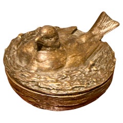 A vide-poche in bronze in the shape of a bird's nest