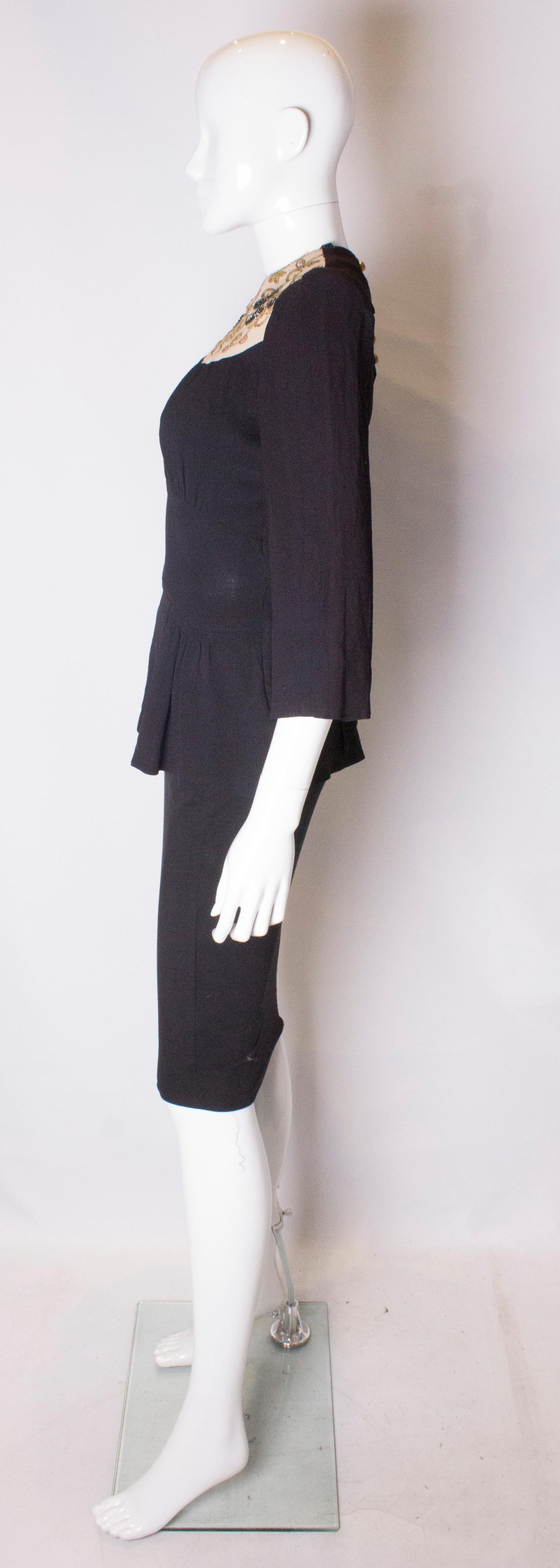 A vintage 1940s black applique and beaded tie back top blouse small Damen
