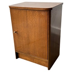 A vintage 1950/60s petite compact oak bedside cabinet