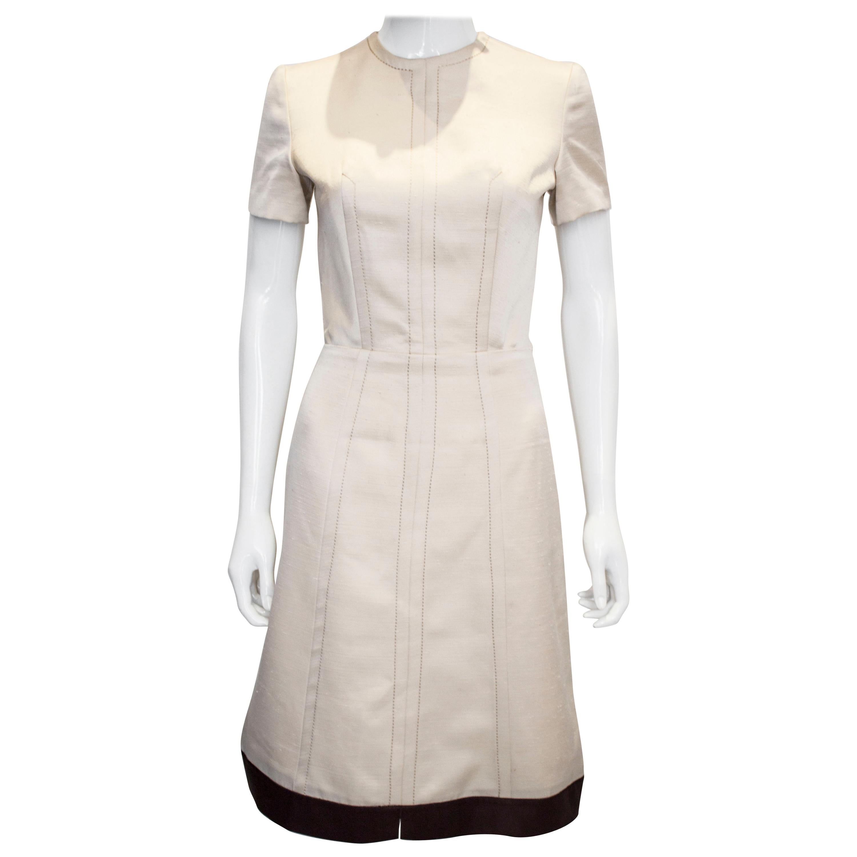 A vintage 1950s - 1960s cream fitted raw silk dress small