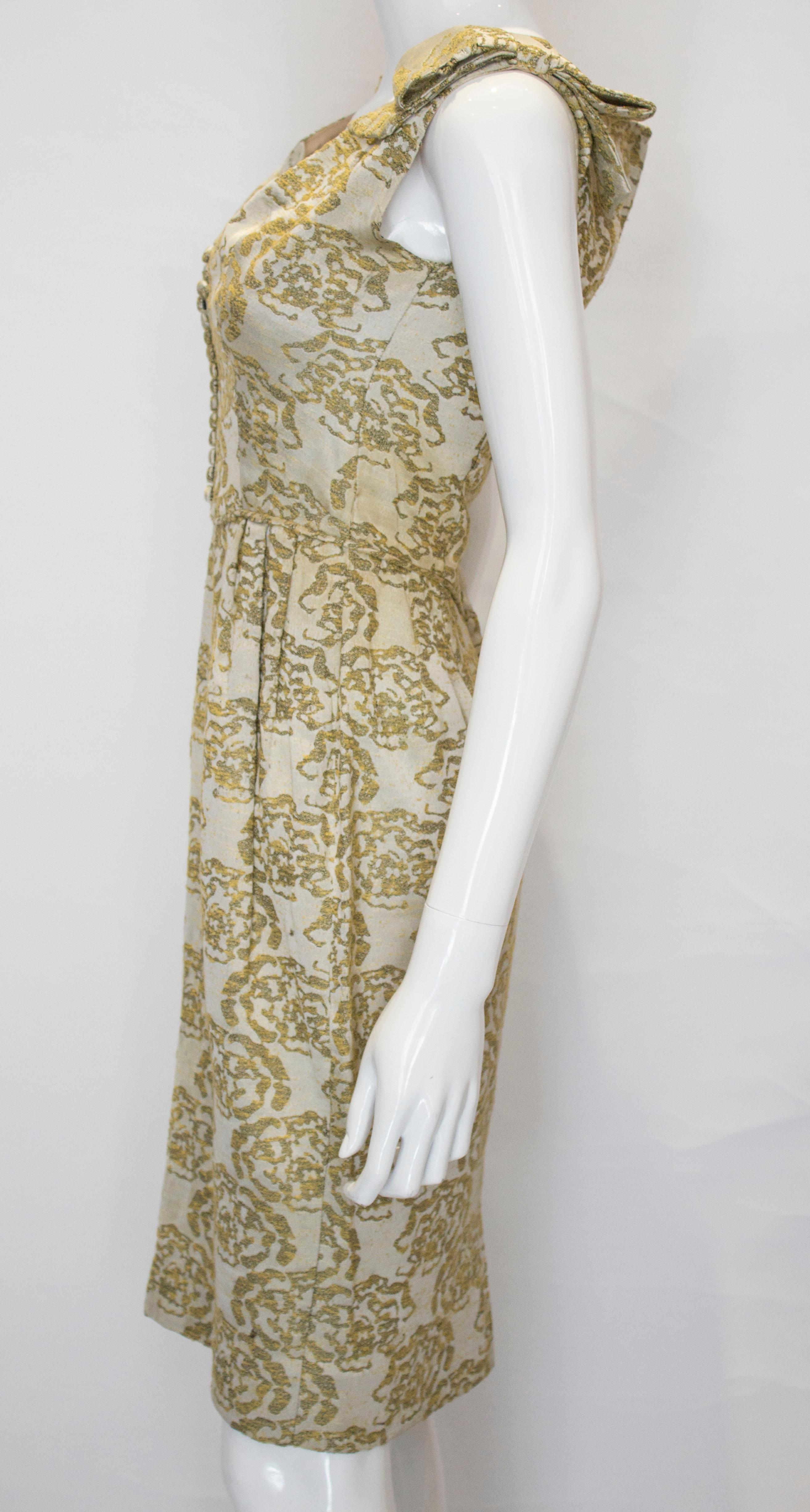 Women's A vintage 1950s - 1960s olive green & gold brocade cinch wiggle cocktail dress 