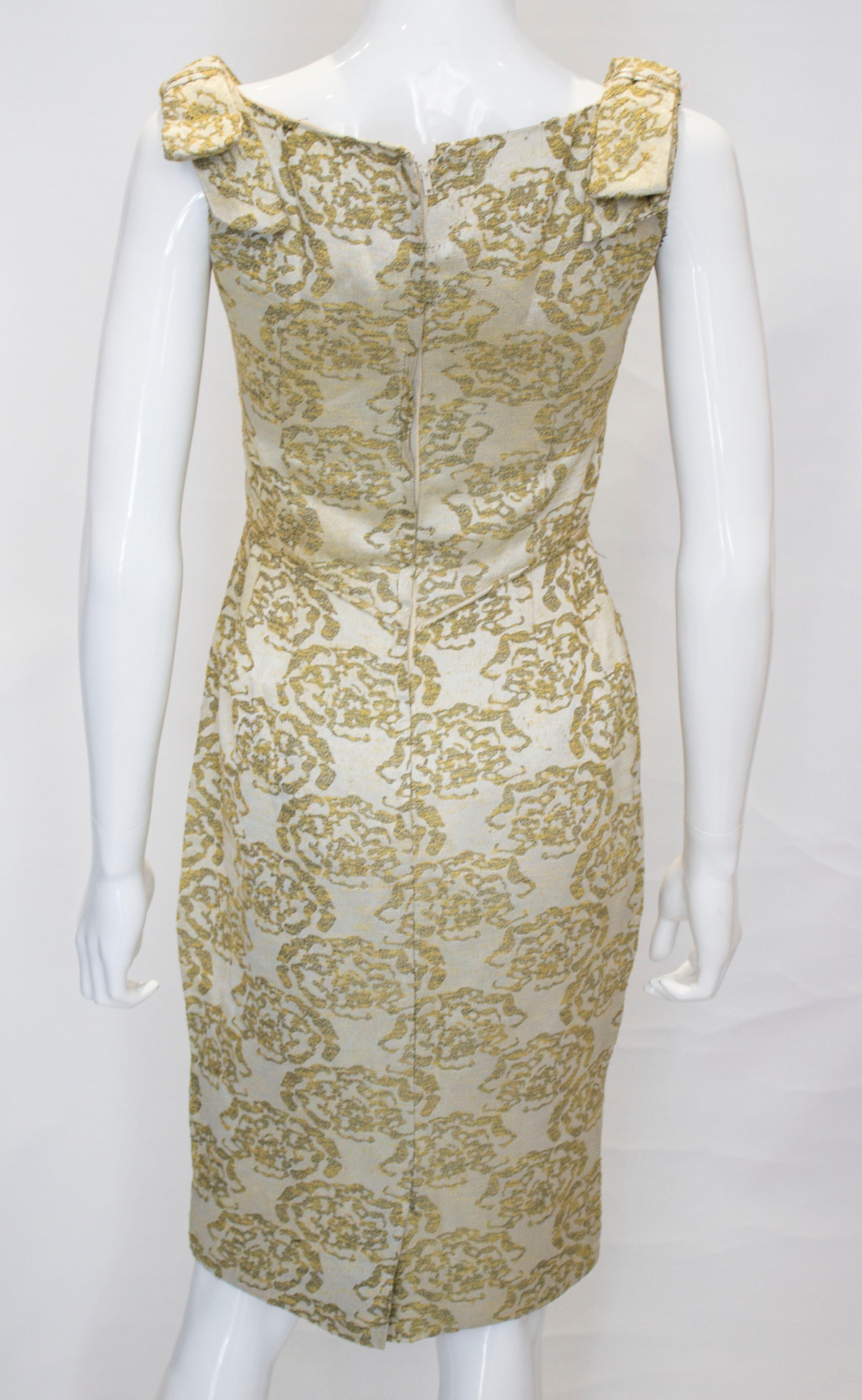 A vintage 1950s - 1960s olive green & gold brocade cinch wiggle cocktail dress  2