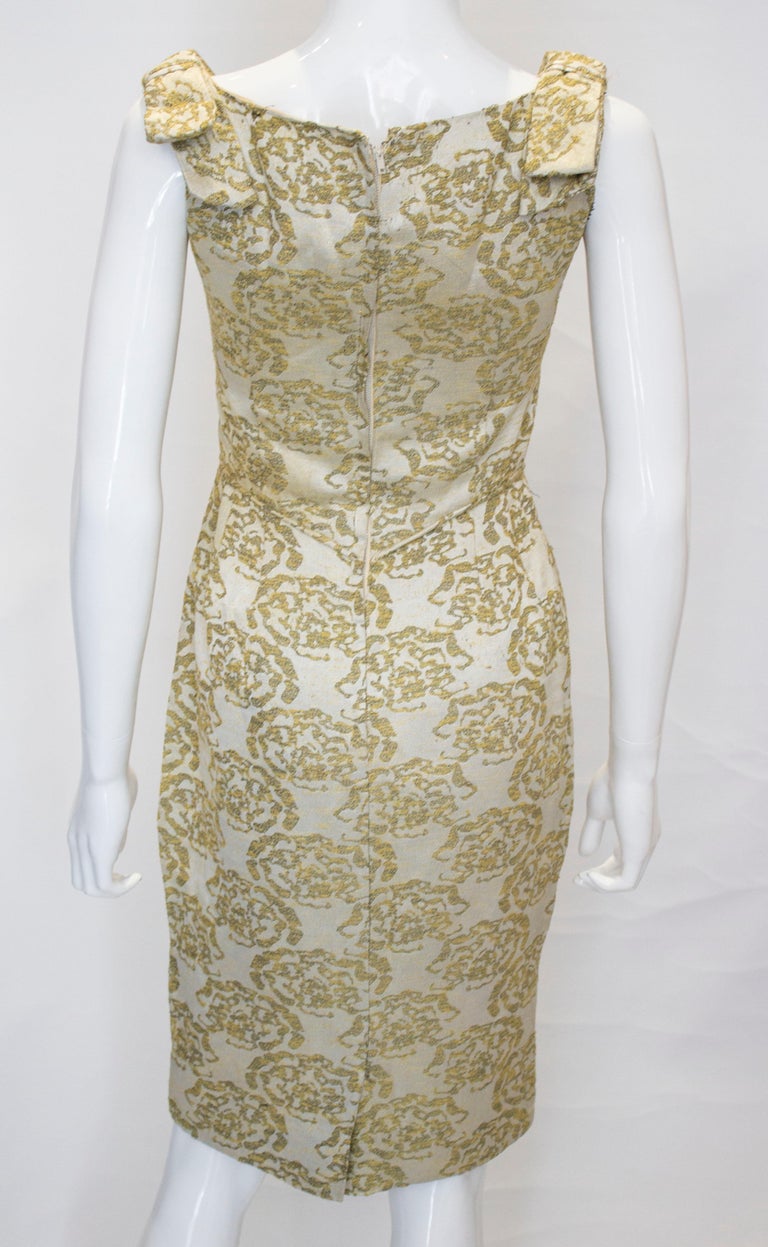 A vintage 1950s - 1960s olive green and gold brocade cinch wiggle ...