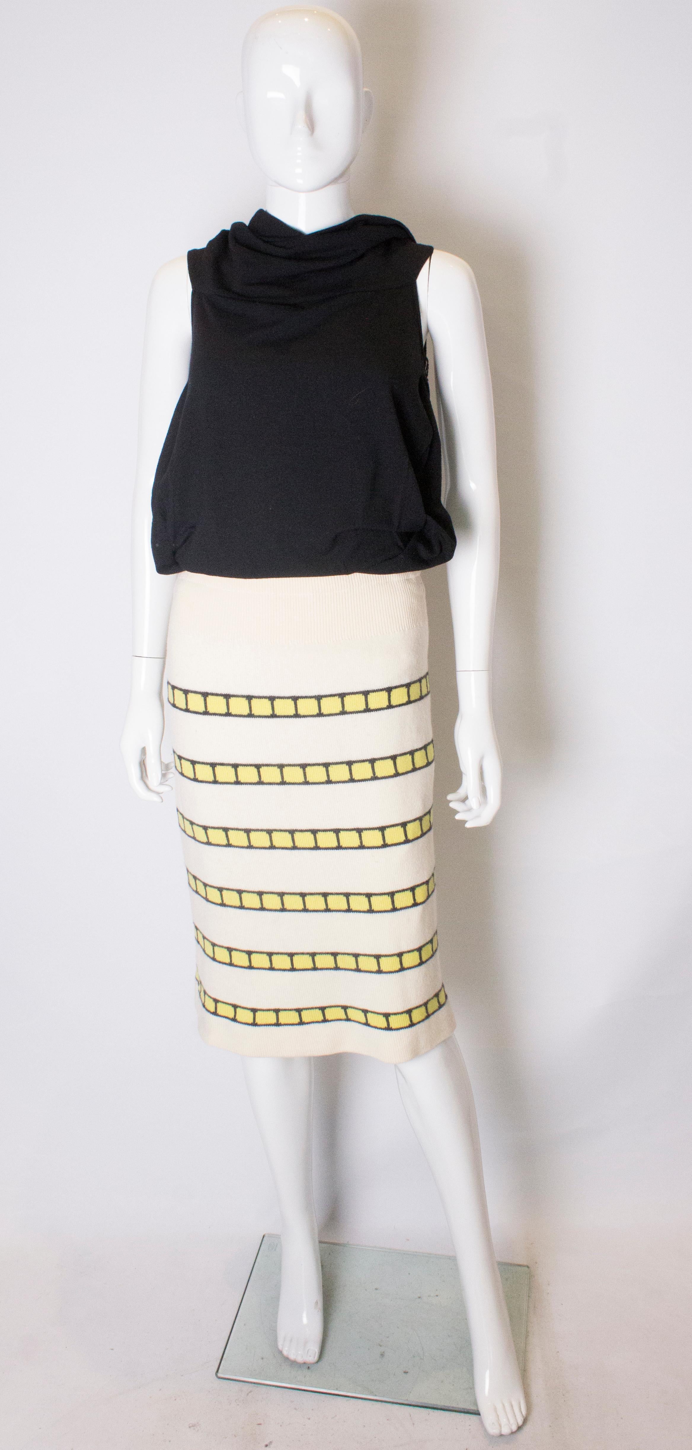A vintage 1960s cream cashmere (made in scotland) stripe pencil skirt 

cream with yellow and black detail 