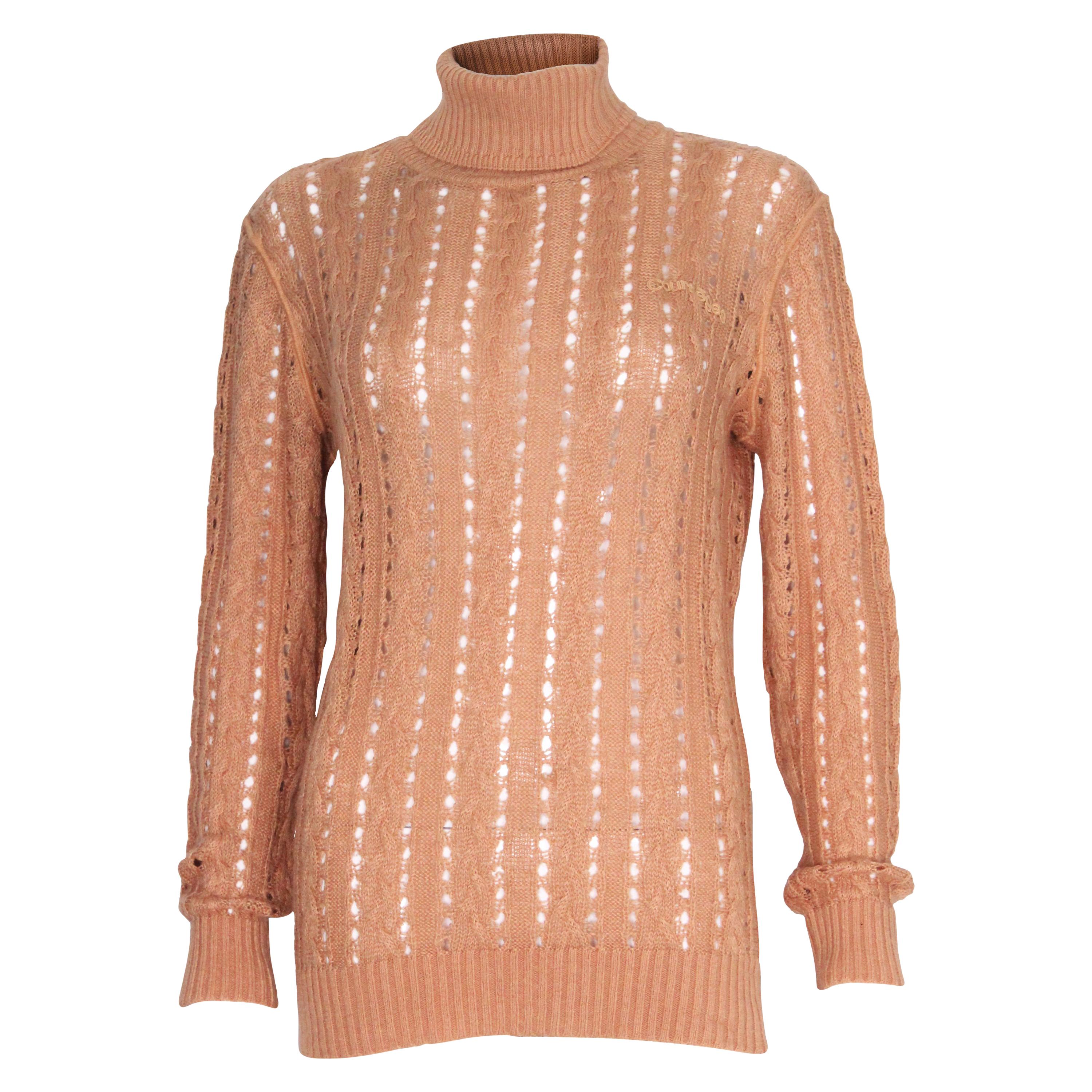 A vintage 1970s camel coloured Courreges knitted Poloneck Jumper