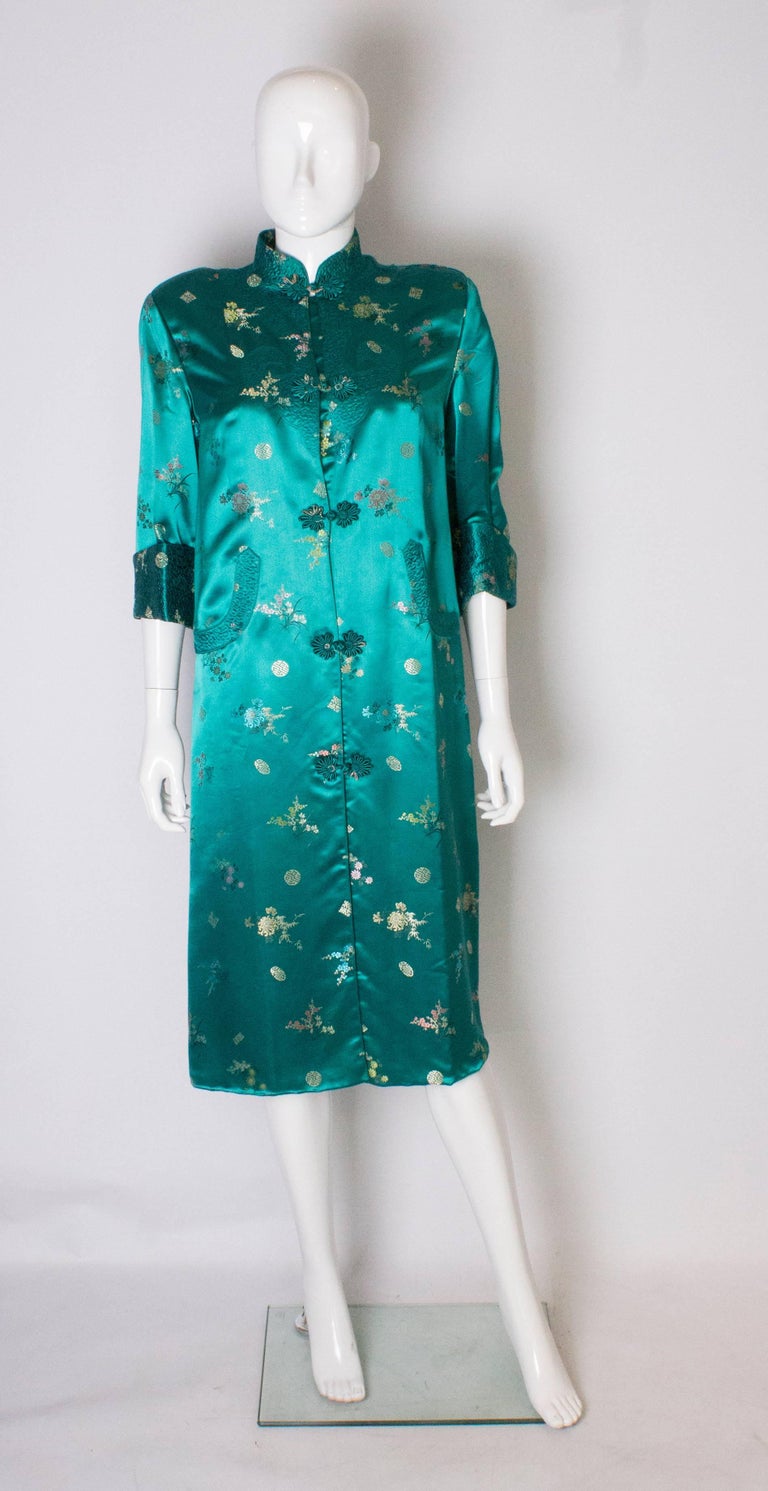 A Vintage 1970s Turquoise Chinese Coat with Standup Collar and Decorative Pockets at 1stDibs