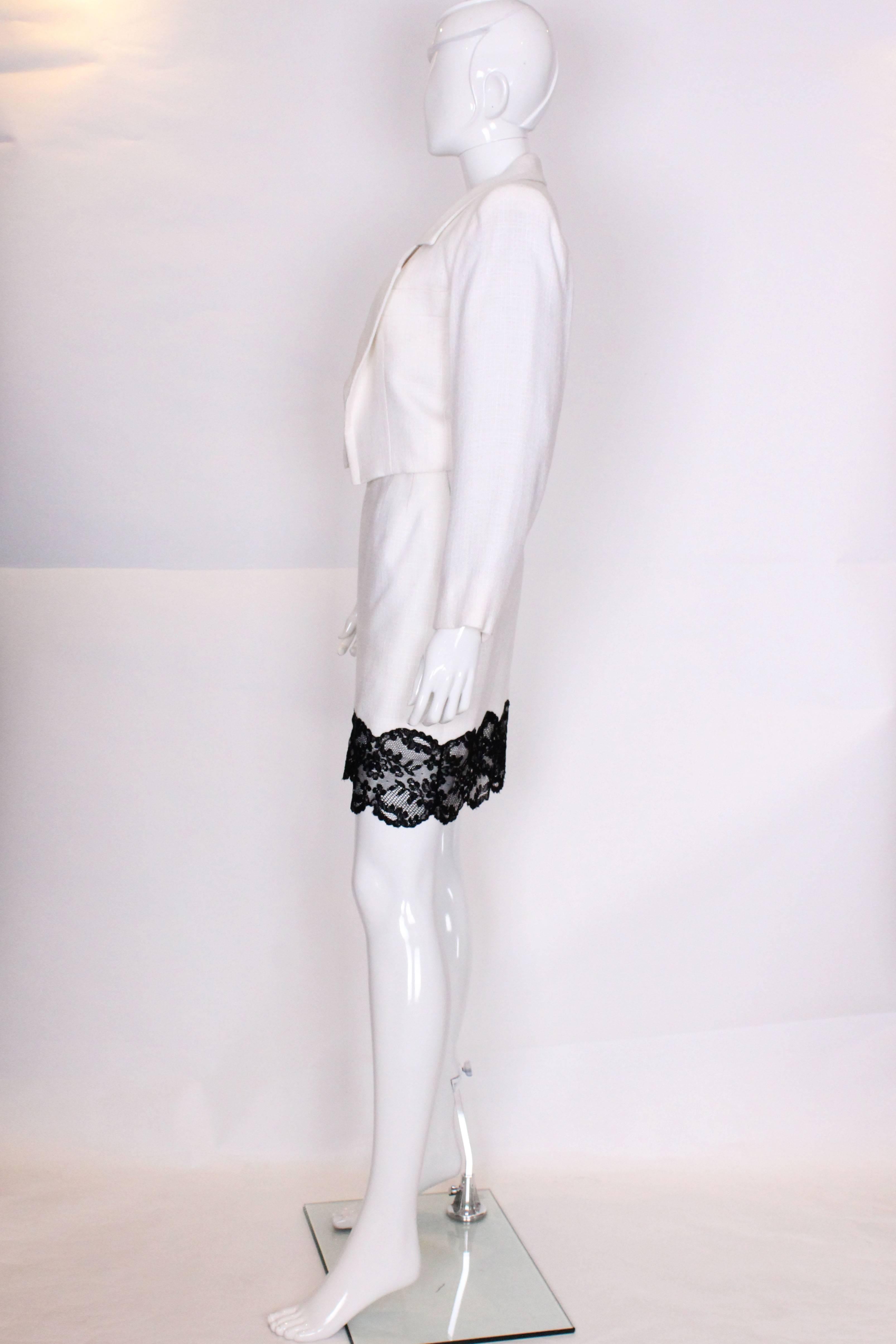 A vintage 1990s white with black lace trim Yves Saint Laurent Skirt Suit In Excellent Condition In London, GB