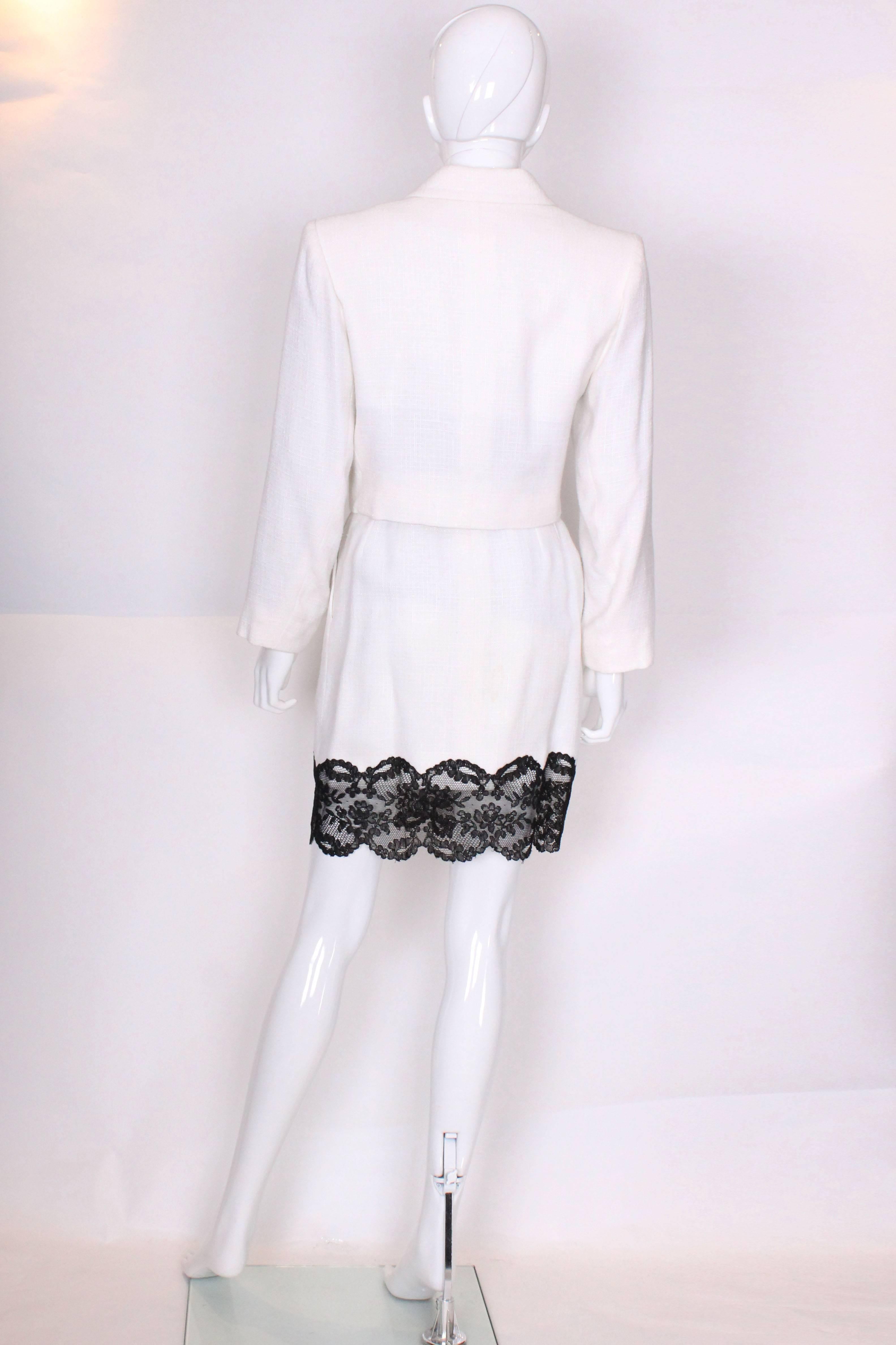 Women's A vintage 1990s white with black lace trim Yves Saint Laurent Skirt Suit
