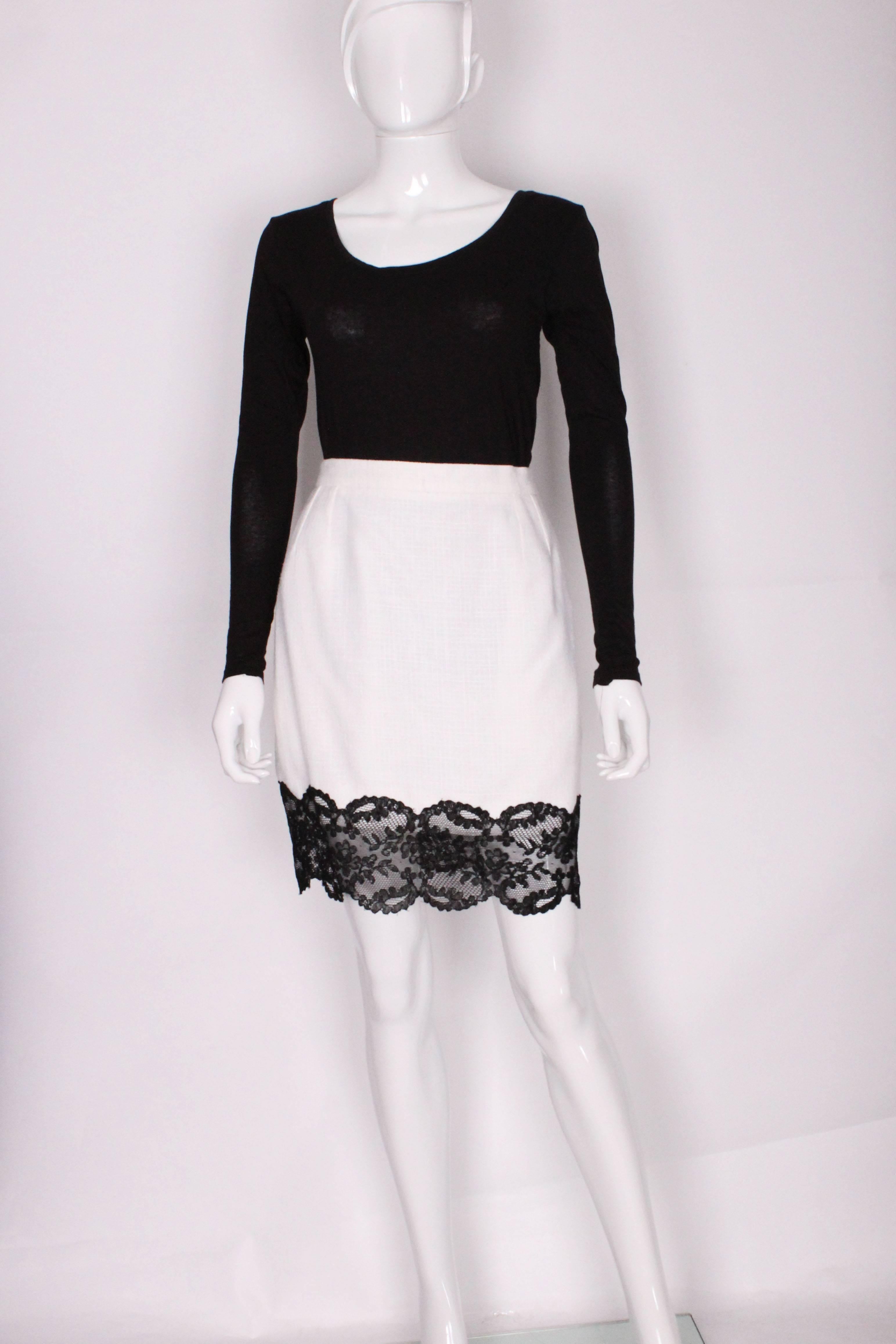 A vintage 1990s white with black lace trim Yves Saint Laurent Skirt Suit 1