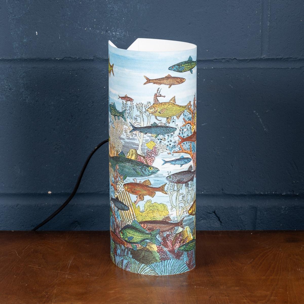 A beautiful table lamp by Piero Fornasetti. This particular model retailed by Antonangeli in the 1990s, now discontinued and appreciating in value. More importantly it gives any room a very chic twist on lighting with its plexiglass structure with