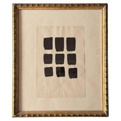Un disegno astratto vintage a inchiostro su carta, incorniciato in una cornice in legno dorato effetto bambù