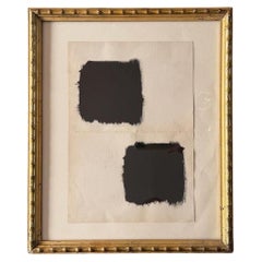 Una obra abstracta vintage en tinta sobre papel, con un marco de madera dorada imitación de bambú