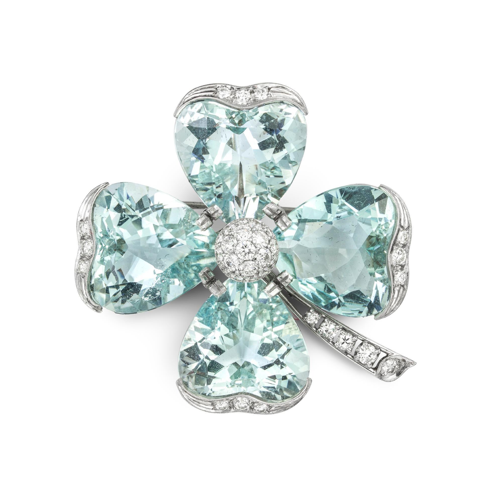 A vintage aquamarine and diamond flower head brooch, the brooch with round brilliant-cut diamond set domed centre surrounded by four heart shape aquamarine set petals each measuring approximately 18.2 x 18.5mm and estimated to weigh a total of 80