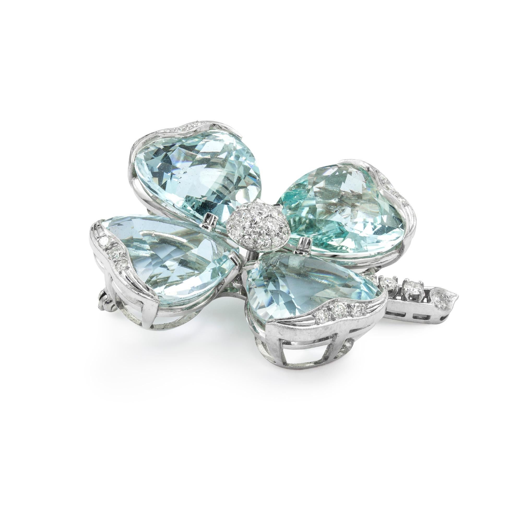 A vintage aquamarine and diamond flower head brooch, the brooch with round brilliant-cut diamond set domed centre surrounded by four heart shape aquamarine set petals each measuring approximately 18.2 x 18.5mm and estimated to weigh a total of 80