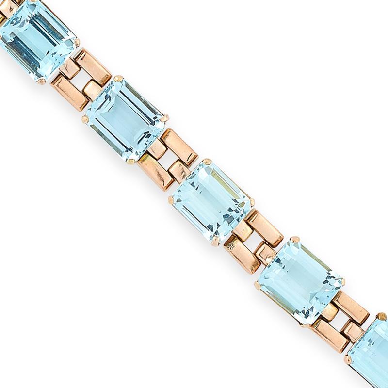 A vintage aquamarine bracelet, set with seven emerald cut aquamarines totalling 42.0-46.0 carats, within an open link design, unmarked.

Length: 18.0cm
Gross weight: 27.8g