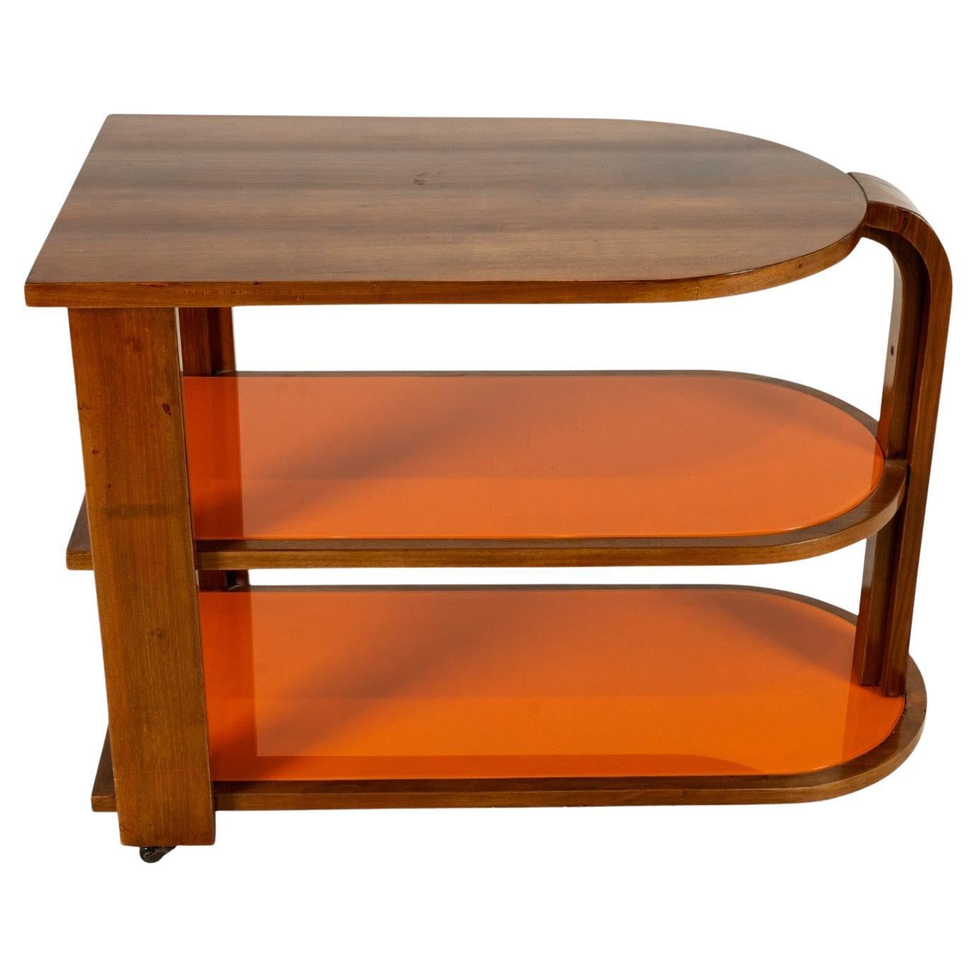 A Vintage Art Deco Style Bar Cart With Orange Glass Shelves For Sale