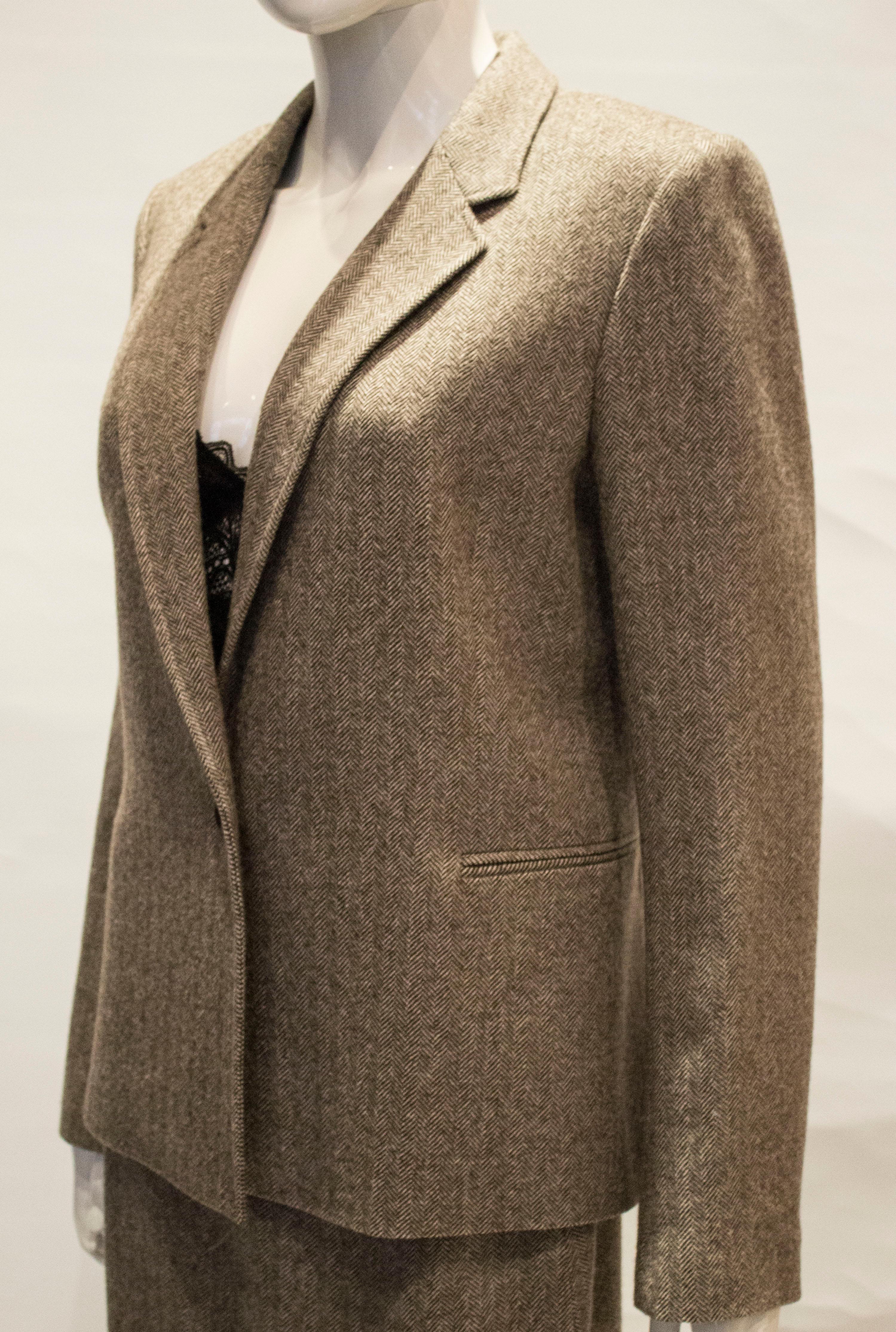 A lovely autumnal wool jacket by joseph 

The jacket has a one button opening and a pocket on either side .
Bust 39'',length 25''