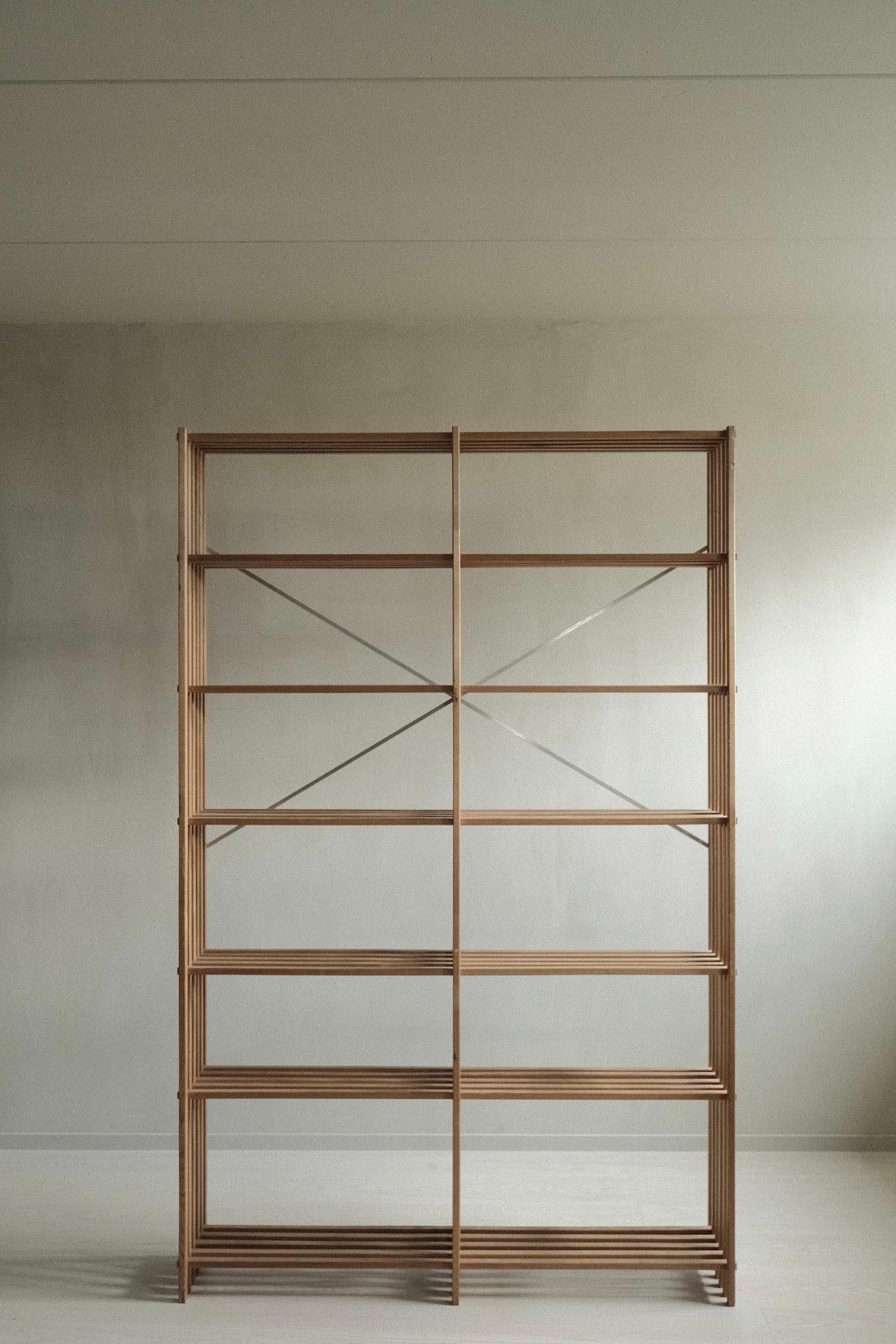 A Mid-Century Modern Danish slatted bookcase by Thorvald Lissau. In solid pine with 6 levels. From circa 1970s.

To ensure stability it should be fitted to the wall. It is not suitable to be standalone. 

