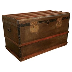 A Vintage Brass and Bound Canvas Travel Steamer Trunk  A very useful decorative 