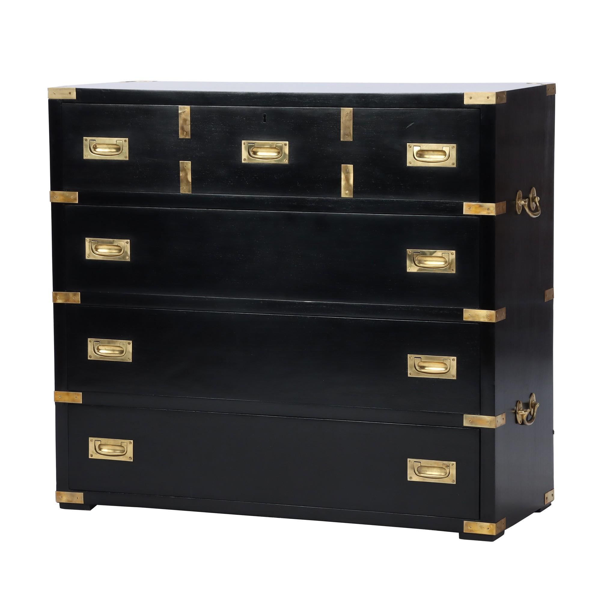 Mid-Century Modern Campaign style ebonized dresser with brass pulls and corner details. Top drawer opening to a secretary desk with small drawers and compartments and a pull-down slope with embossed leather writing surface. Circa 1940.