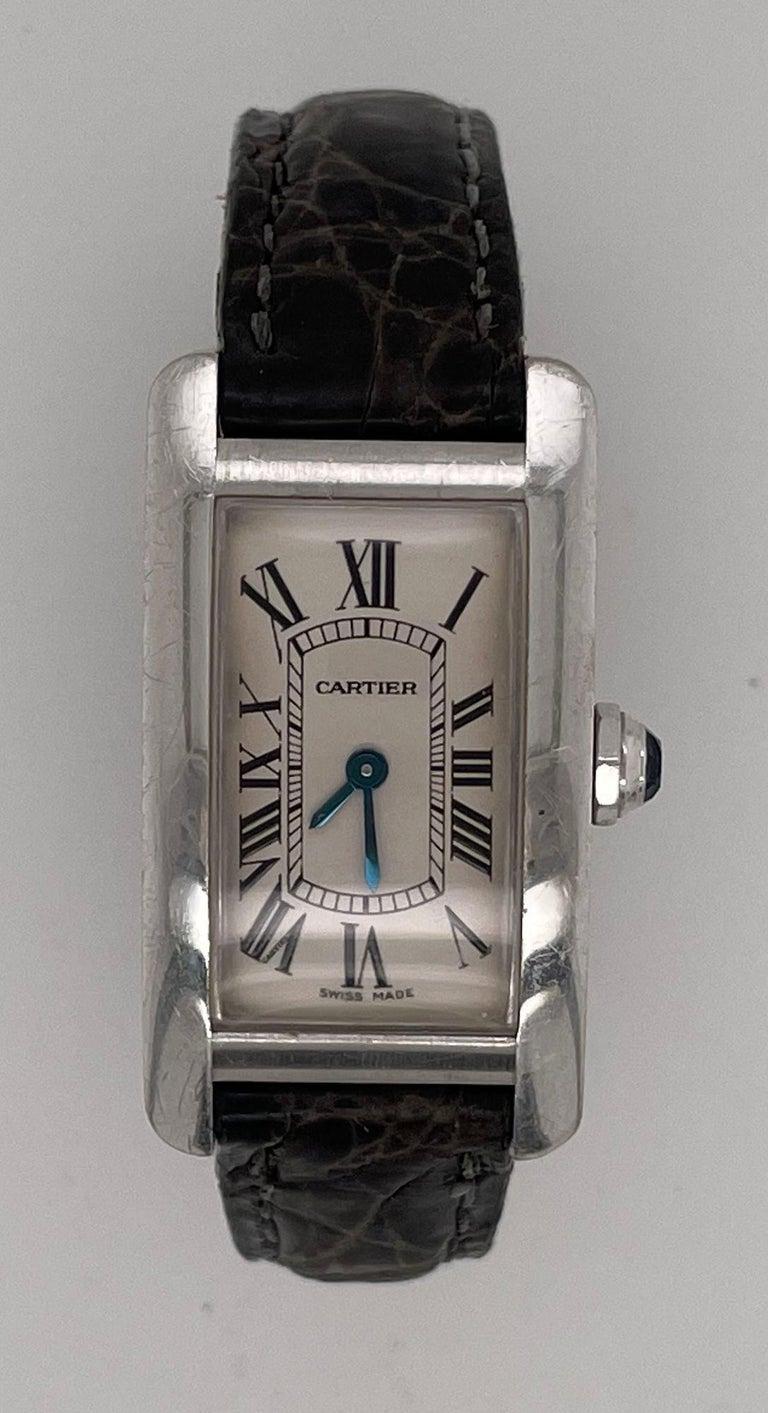 A Vintage Cartier Tank Allonge Wrist Watch in stainless steel case, with Alligator leather strap 

The watch features a 3/4 by 1.5 inch in stainless steel case, with warm brown leather strap and a Cartier buckle. The watch has a cream/white dial and