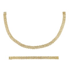 A vintage diamond and gold necklace and bracelet set