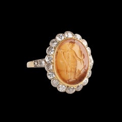 A Vintage gold ring with diamonds and set with a Roman Carnelian Intaglio. Tyche