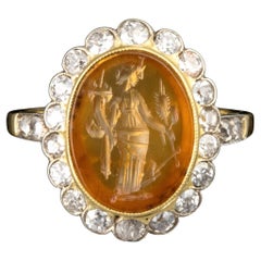 A Vintage gold ring with diamonds and set with a Roman Carnelian Intaglio. Tyche