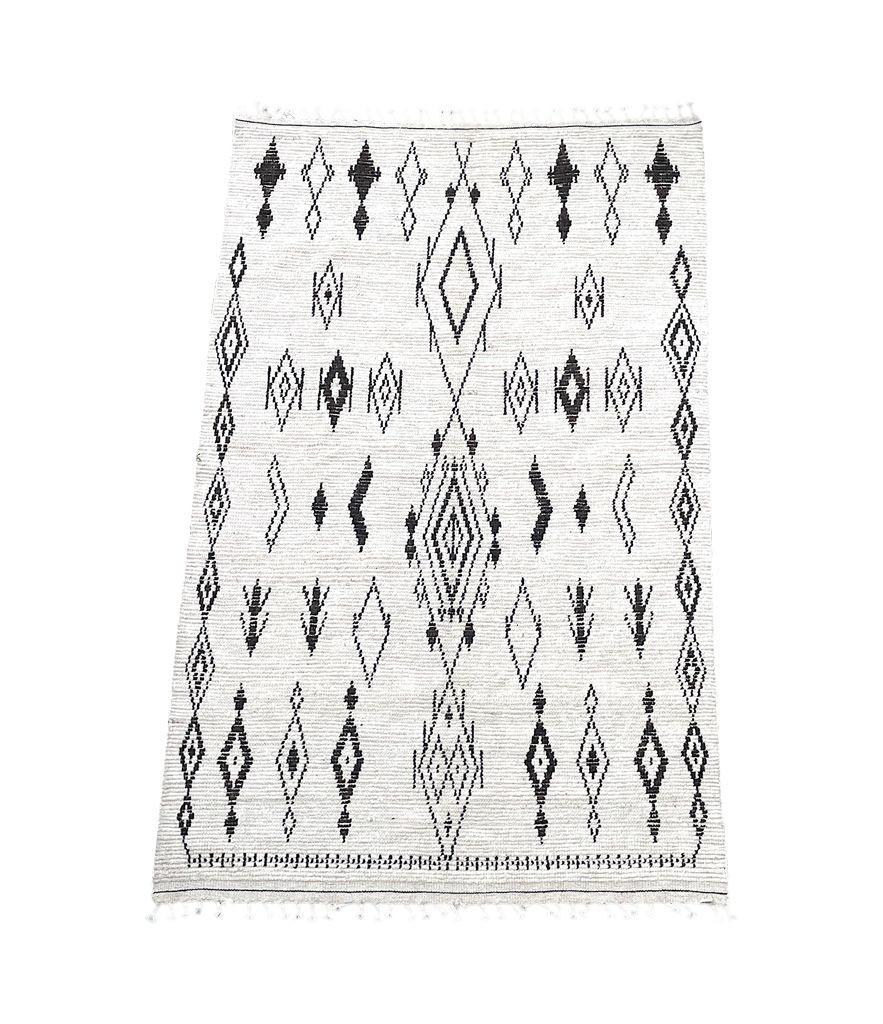 A vintage handwoven Moroccan berber rug, with tribal pattern For Sale 5