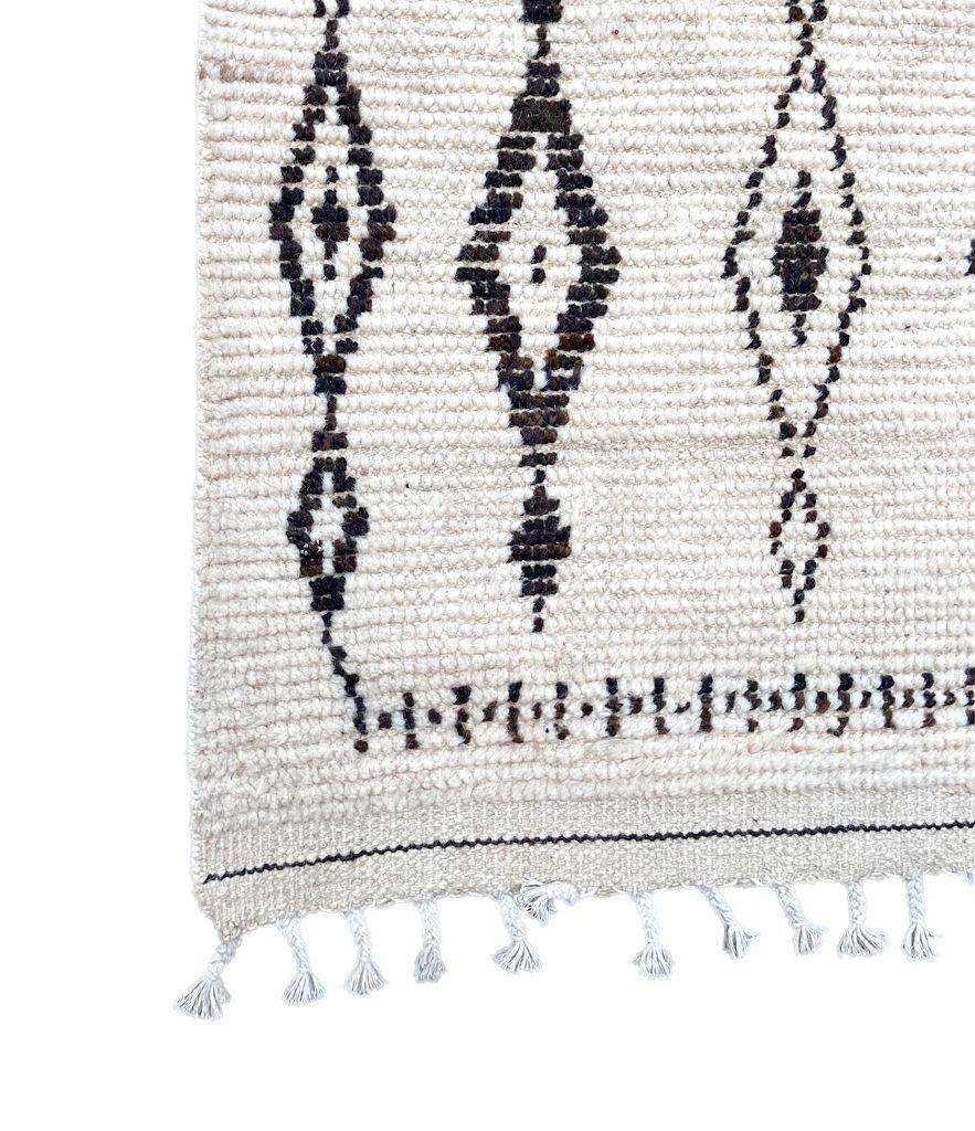 A vintage handwoven Moroccan berber rug, with tribal pattern For Sale 6