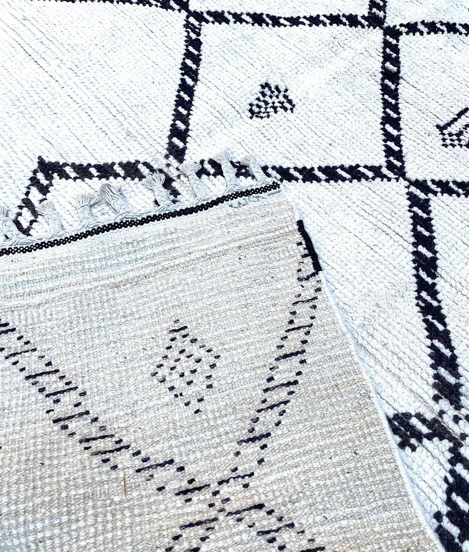 A vintage handwoven Moroccan berber rug, with tribal pattern For Sale 8