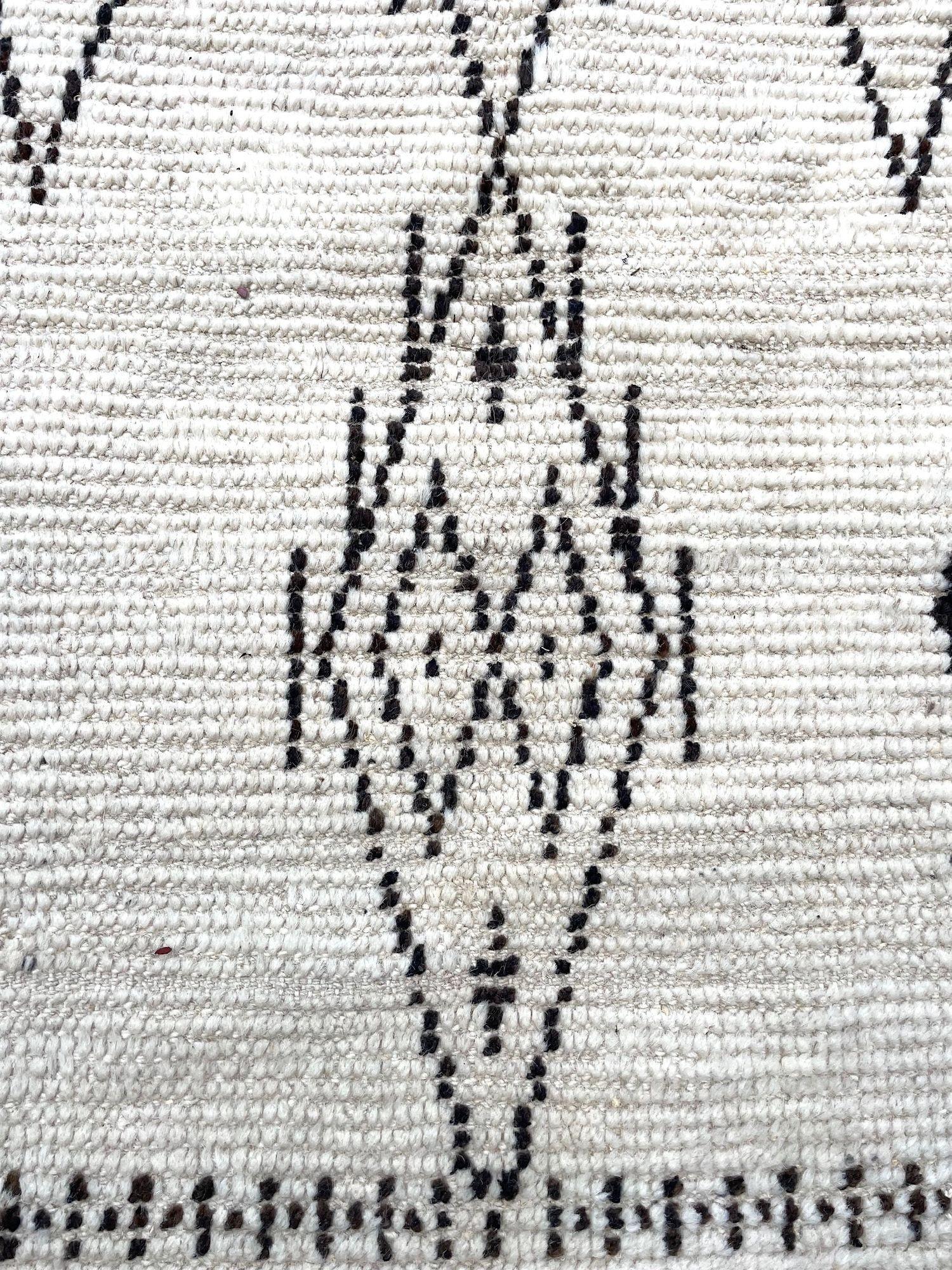 A vintage handwoven Moroccan berber rug, with tribal pattern For Sale 9