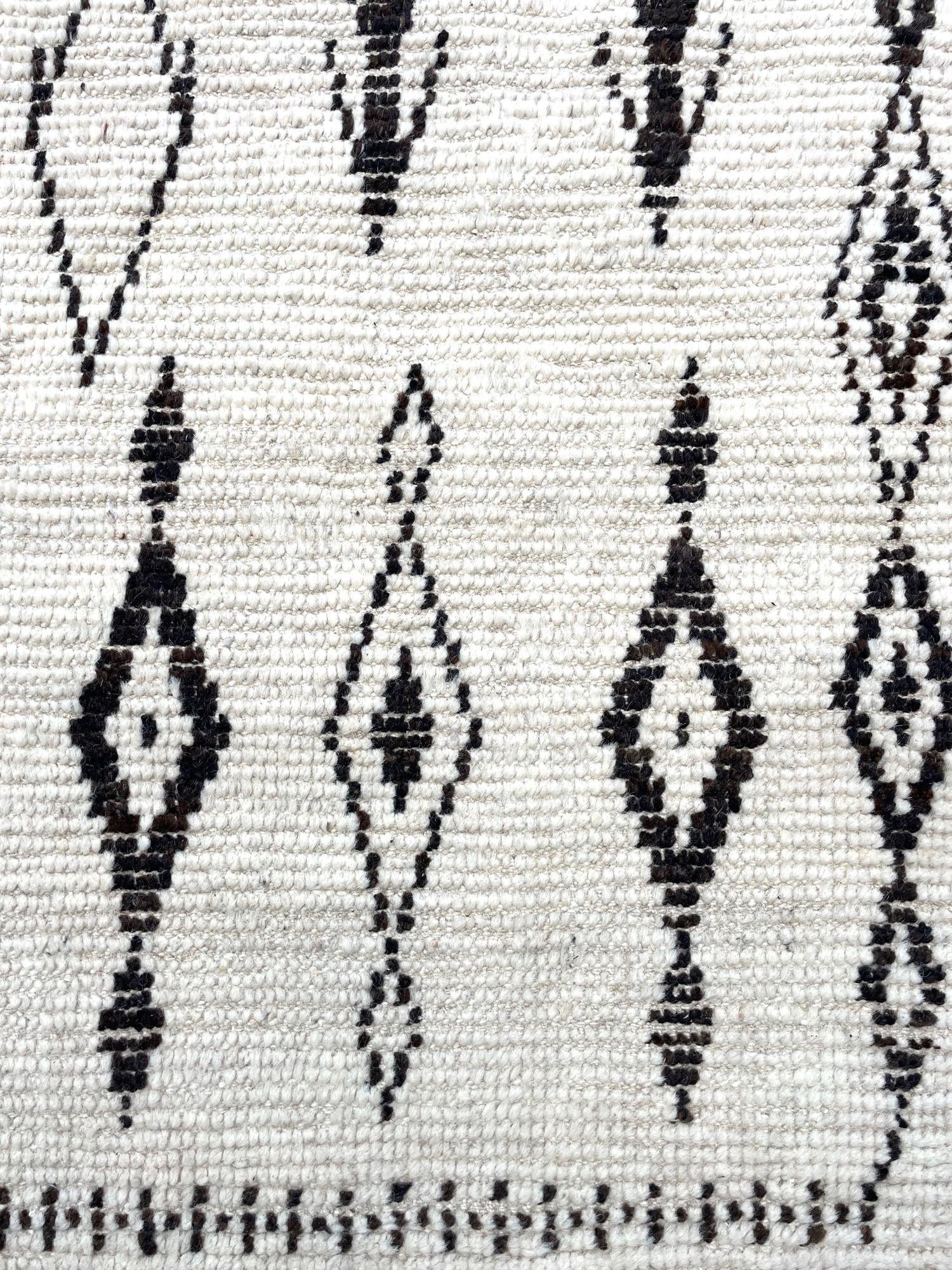 A vintage handwoven Moroccan berber rug, with tribal pattern For Sale 1